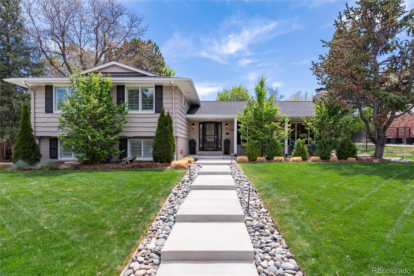 BEST IN CLASS!!  This home has been recently renovated, remodeled, and updated both inside and out!  Open and bright layout and meticulously maintained, this exceptional Cherry Point home showcases timeless finishes and thoughtful upgrades throughout. A welcoming floorplan is highlighted by rich wood floors, elegant crown molding, and an abundance of natural light. The formal living room with a gas fireplace is surrounded by a statement vertical stone wall that flows seamlessly into the formal dining room, creating an ideal setting for both everyday living and entertaining.  The eat-in kitchen features a spacious island with bar seating, slab granite countertops, stainless steel appliances, under-cabinet lighting, and a sunny breakfast nook with sliding doors leading to the back patio. Upstairs, the primary suite serves as a private retreat with a beautifully appointed ensuite bath, complete with a double vanity, expansive walk-in shower with bench, and seamless glass enclosure. Two additional bedrooms and a full bath complete the upper level. The lower level offers a cozy family room, convenient powder room, and garage access.  The finished, garage is immaculate with a new slab epoxy coated floor and insulated garage doors. The finished basement expands the living space with a versatile family or flex room with a gas fireplace, guest bedroom, full bath, laundry room, and egress windows.Enjoy Colorado living year-round in the large, fenced yard which includes over $200K in landscaping with new plantings, lighting, sprinkler system, and new shed with electricity.  New concrete hardscape includes the front patio, walkway, and steps, extended back patio, natural stone walkways, new driveway, custom fabricated iron fence, gas line to the patio and stone walls - perfect for relaxing or outdoor gatherings. Ideally located with easy access to I-25 and the DTC, this home truly offers the perfect blend of comfort, style, and convenience.