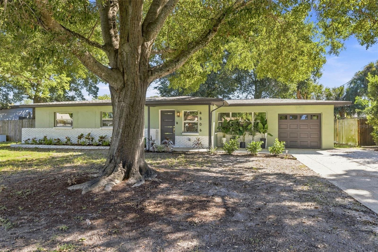 Beautifully reimagined through a fully permitted renovation with the city of Tampa, 4506 S Cameron Avenue offers the perfect blend of modern design, thoughtful finishes, and everyday functionality in South Tampa’s desirable Fair Oaks–Manhattan Manor neighborhood. Nestled beneath a canopy of mature trees, this stunning 3-bedroom, 2-bathroom home features 1,493 square feet of beautifully updated living space with an inviting open-concept layout, designer kitchen featuring new stainless steel appliances, and stylishly renovated bathrooms. The spacious primary suite is a standout, featuring an expansive walk-in closet with a custom-style organization system offering abundant shelving, hanging space, and storage. Additional highlights include a 2021 roof, attached one-car garage, dedicated laundry room, and a spacious fenced backyard ideal for outdoor entertaining. Ideally located near Bayshore Boulevard, MacDill Air Force Base, Downtown Tampa, and South Tampa's popular shopping and dining destinations. No flooding from Hurricane Helene.