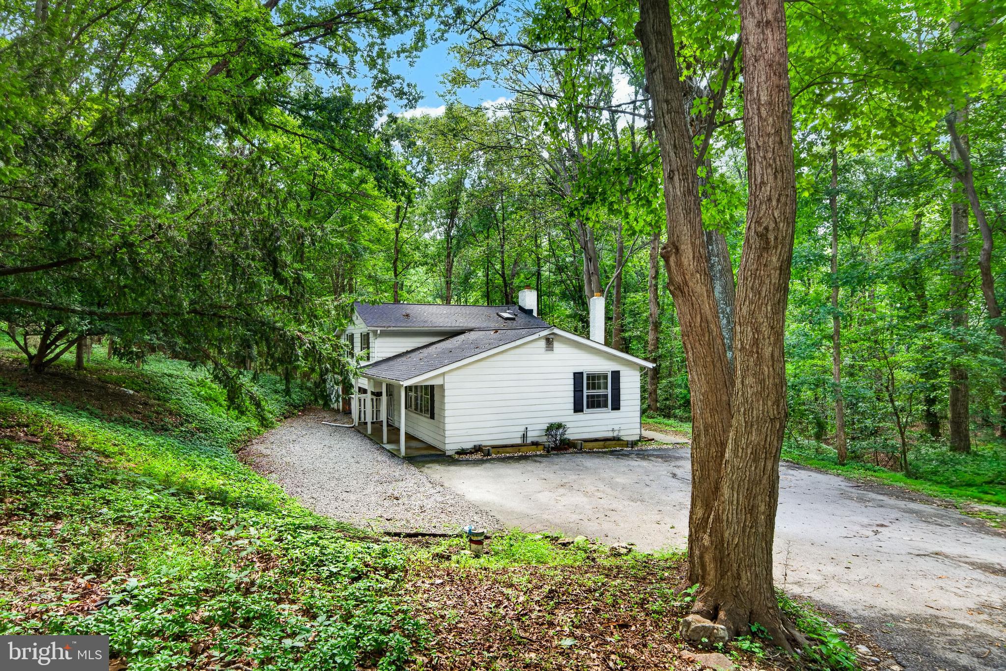 Nestled on a beautifully private one-acre homesite in the desirable Crestmont Farms community, this charming split-level home offers three bedrooms, one full and one-half bath, and an inviting blend of comfort and style. A covered front porch welcomes you into the spacious Great Room, an ideal gathering space for entertaining family and friends. Beautiful wood-grain laminate flooring flows throughout the home, creating a warm and cohesive feel. The well-appointed Kitchen provides an abundance of storage and features Whirlpool stainless-steel appliances, a center island, and gorgeous granite countertops. The large Family Room is highlighted by a striking fireplace with elegant black marble tile facing, while a conveniently located Powder Room adds to the home’s functionality. The nearby Laundry Room also houses the home’s utilities for added convenience. Two of the three generously sized bedrooms feature dramatic lofted ceilings and sliding doors that open to a private, multi-level deck—perfect for relaxing, entertaining, or enjoying the peaceful surroundings. All of this is complemented by a highly convenient location, the sought-after Downingtown Area School District, and the benefit of low property taxes. A wonderful opportunity to enjoy privacy, comfort, and convenience in one inviting package—don’t wait; this home won’t last long!