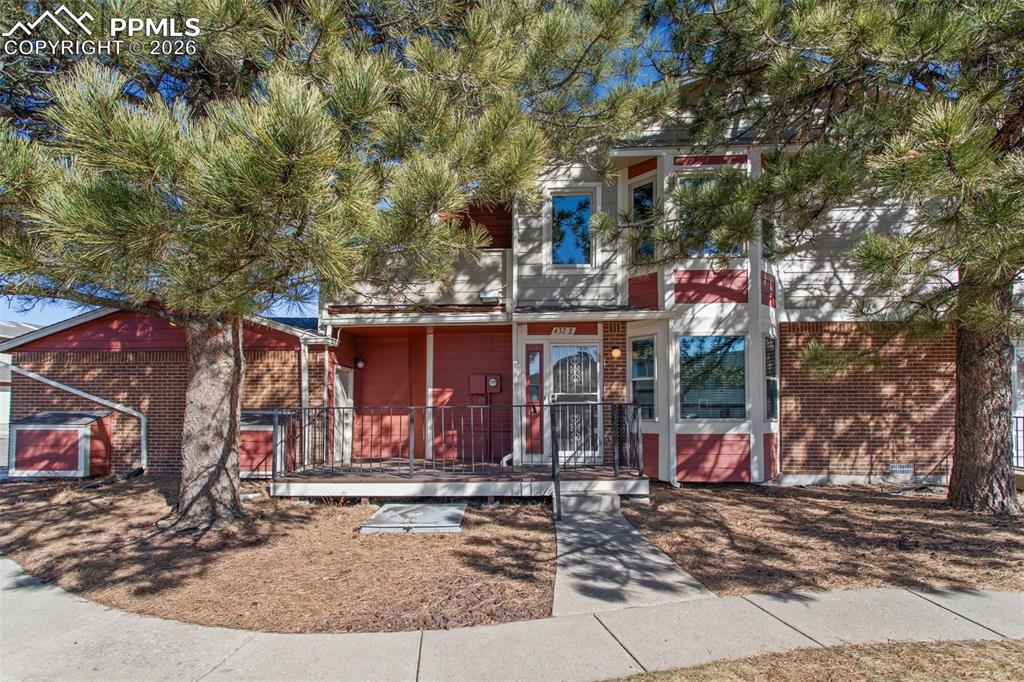 ***See the Amazing Video at the Virtual Tour Link on the listing***Beautiful end-unit townhome in the heart of the Rockrimmon neighborhood! Nestled in a peaceful, park-like setting with mature trees and mountain views, this home offers both comfort and convenience in the award-winning Academy D20 School District.Step inside to soaring two-story ceilings in the entryway, filling the home with natural light from the huge windows.The upper level layout maximizes both space and functionality with ample storage throughout. Vaulted ceilings, fresh new carpet, and bottom-up/top-down blinds for privacy and ambiance. Well-equipped kitchen includes all major appliances and opens to a private balcony, ideal for enjoying your morning coffee in the quiet community. The dining room has a bay window allowing views of Pikes Peak!  The primary suite includes a skylight in the bathroom, flooding the space with natural light. Both bedroom suites feature charming window seats and generous closet space.Enjoy in unit laundry with Washer & Dryer included. This unit includes a 2 car garage, offering secure storage for your vehicle and additional belongings. The attached garage offers even more convenience with an extra freezer and refrigerator, plus direct access to the iron-fenced patio, which extends to both the front entrance and garage.Residents enjoy fantastic community amenities, including a clubhouse, indoor pool, exercise room, sports courts, and walking paths. With a serene forest-like setting and easy access to parks, shopping, and dining, this home is a rare find!Don’t miss out—schedule your showing today!