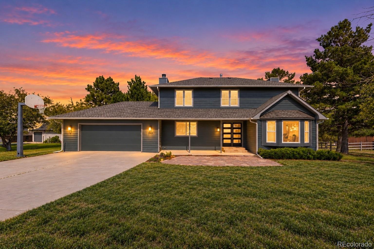 Welcome to this beautifully updated two-story home in The Pinery neighborhood in Parker, CO offering the perfect blend of space, privacy, and convenience. Set on a large lot with mature trees, this home provides a peaceful, nature-filled setting while still being close to shopping, dining, schools, parks, and all that Parker has to offer. A covered front porch, large driveway, and attached garage create a welcoming first impression.The backyard offers a true retreat with a spacious concrete patio overlooking the expansive yard, wood-fenced pasture, and mature pines. Enjoy the peaceful surroundings and occasional visits from local wildlife, including deer, creating a tranquil setting that feels tucked away from it all.Inside, wide-plank flooring, plantation shutters, and modern light fixtures create a cohesive, updated aesthetic. The main level features a spacious living room, family room with a whitewashed brick fireplace, dining room with designer accent wall, and updated kitchen with two-tone cabinetry, tile backsplash, stainless steel appliances, gas range, and generous counter space.Upstairs, the primary suite features a spa-like ensuite with skylight, dual vanities, large walk-in tiled shower with rainfall showerhead, and oversized custom closet. Two additional bedrooms, well-appointed bathrooms, and a private office complete the upper level.The finished basement adds a large recreation room, two additional bedrooms, renovated bathroom, laundry room, and unfinished storage.Thoughtful updates, flexible living space, a large private lot, and a peaceful natural setting—all while remaining close to everything. Discounted rate options and no-lender-fee future refinancing may be available for qualified buyers.