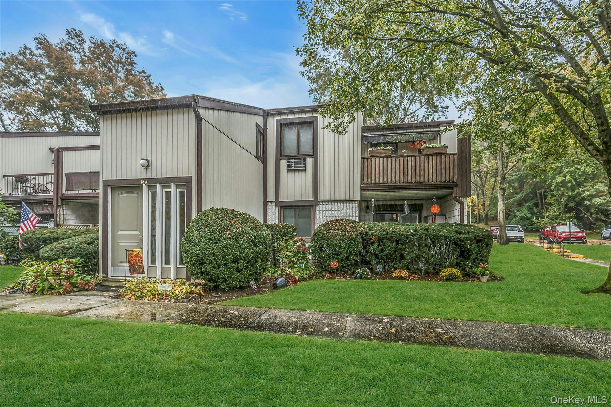 Welcome to this tastefully updated 2-bedroom, 1-bathroom garden-style condo located in the highly sought Nob Hill North community of Ronkonkoma. Set within a peaceful, well-maintained gated complex offering a clubhouse, in-ground pool, tennis courts, fitness center, and extra shared storage room, this home seamlessly combines modern luxury with everyday comfort. A security guard is present nightly from 7 PM to 5 AM, providing additional peace of mind.

Step inside to discover a bright open-concept living area enhanced with smart home technology—control your lighting, temperature, and surround sound effortlessly. The modern kitchen showcases stainless steel appliances, quartz countertops, and custom cabinetry, ideal for both everyday meals and entertaining.

Both bedrooms are spacious and welcoming, offering generous closet space. The covered balcony provides a perfect spot to relax and enjoy the outdoors year-round. Enjoy the convenience of having your own washer and dryer right in the unit, making laundry a breeze.

This week, the hallway and stairs were freshly painted and updated, giving the building a clean, refreshed appearance.

Move right in and enjoy the perfect blend of style, technology, and comfort—your new home awaits!