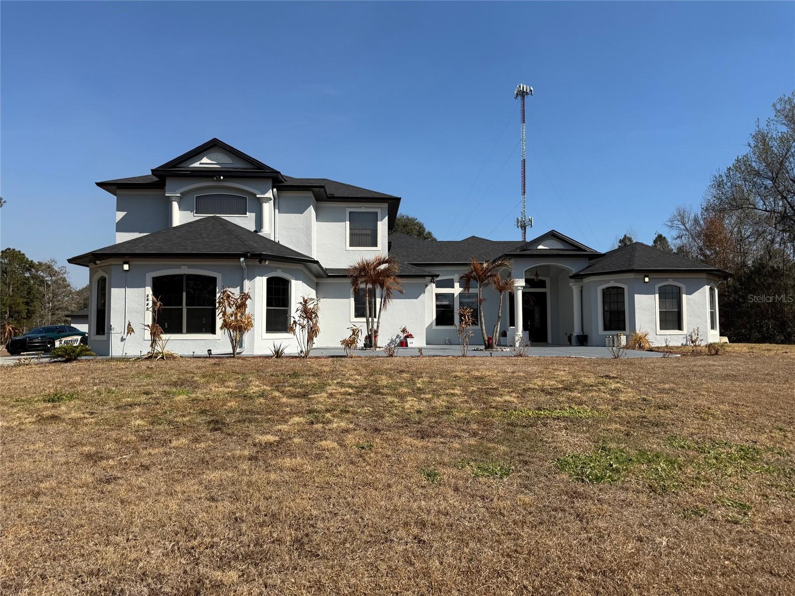 LARGE ONE OF A KIND CUSTOM HOME ..MAIN HOME AND AN ADDITIONSL 2 BEDROOM INDEPENDENT HOUSE.. THE MAIN HOME IS 4 BEDROOMS AND 4.5 BATHS AND THE GUEST HOME IS 2 BWTHROOMS, 2 BATHS. BOTH IN EXCELENT CONDITION.  ALSO INCLUDES A 2 CAR DETACHED GARAGE AND A LOT OF ROOM TO ROAM. ALL IN A PREMIUM ONE AND A HALF CORNER LOT. JUST MINUTES FROM THE ORLANDO INTETNATIONAL AIRPORTAND COCOA BEACH.THE MAIN HOME KITCHEN OFFERS GRANITE CUNTER TOPS, CUSTOM CHERRY WOOD CABINETS,STAINLESS STEEL APPLIANCES AND AN ABUNDANCEOF STORAGE. THE MASTER SUITE FEATURES A TRAY CEILINS, 2 WALKING CLOSETS AND A SPA LIKE BATHROOM WITH DUAL SINKS, A SEPARATE GARDEN TUB AND A WALK IN SHOER, UPTAIR OOFICE MEDIA ROOM AND ALOFT AREA COULD EASILY BE USED AS A SECOND MASTER BEDROOM. LOCATE JUST BEHIND THE HOME IS A 2 BEDROOM, 2 BATH BEAUTY GUESS HOME WITH IS OWN 1 CAR GARAGE. IN ADITIONTHERE IS A DETACHED 2 CAR GARAGE WITH ROOM FOR A WORKSHOP.. THIS IS YOUR DREAM HOME