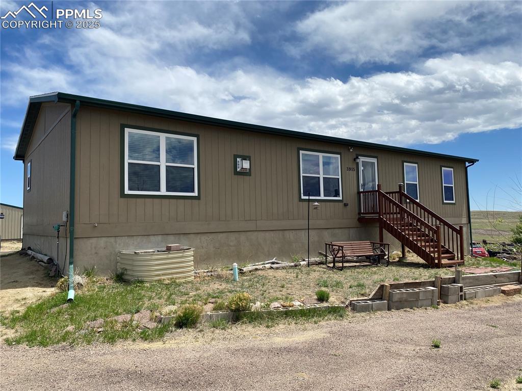 COME AND SEE the wide open spaces with NO HOA RESTRICTIONS on this 40+ acre property ready for new owners. Built in 2015, this 2-story home has all you need to live comfortably on the eastern plains. If you've always wanted your own land to live freely on, this is the place! The main level of the home is fully finished with a cozy living room, gourmet kitchen, dining room with backyard walk-out, two bedrooms adjacent to a shared FULL bathroom, and a laundry area with south-facing exterior door that walks out to a mini-deck. Also on that main level is the Master Suite, featuring a large walk-in closet and 3/4 master bathroom boasting a dual vanity plus extra storage space. Downstairs in the basement you'll find partially finished spaces ready for your preferred uses. Two non-conforming bedrooms (all they need are built-in closets) sit adjacent to another 3/4 bathroom. An oversized game room area is suitable for a variety of functions and sits next to an open area perfect for casual relaxing. The family room features a walk-out to the driveway and DON'T MISS the extra-long storage area tucked next to the stairwell. Outside you'll find a HUGE pole barn / workshop area provided with solar-power and designed for whatever you need to store or stable, including horses. Additional storage spaces for barnyard animals and/or a tractor are near the home, while the backyard features a large, long wooden deck and is fenced in for any household pets. And the fully fenced acreage extends to the east and south, with a propane tank, fully functioning well and septic systems, and installed irrigation if you desire to grow your own crops. You'll rarely find similar Pikes Peak and mountain views, so schedule your showing and you can start your homestead adventure today!