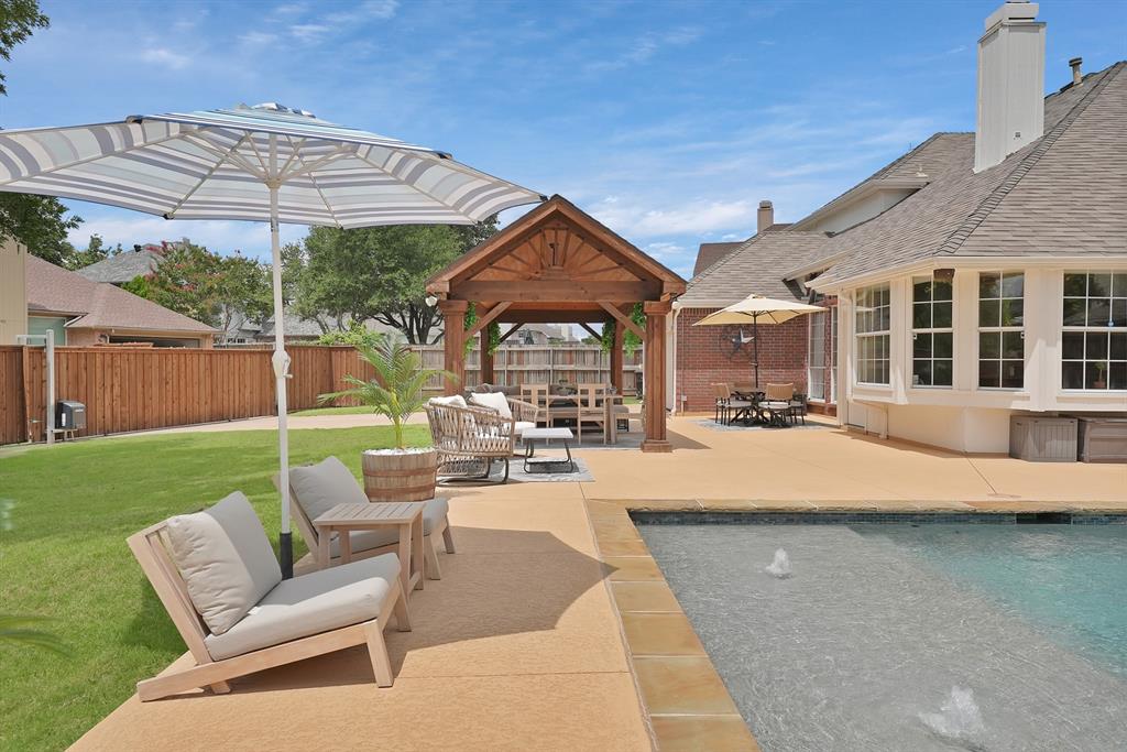 Set on an oversized lot, this beautifully updated home blends modern comfort with resort-style outdoor living. Enjoy a sparkling pool with spa, cedar pavilion, dual fire pits, and an electric gate for added privacy. The water-volleyball-ready pool, new cedar fence, shed, and fresh exterior paint make outdoor living effortless. Inside, a warm and inviting layout offers the perfect space to relax or entertain. Move-in ready and minutes from top Plano ISD schools, shopping, and dining — this rare Plano gem is ready to welcome you home this fall.