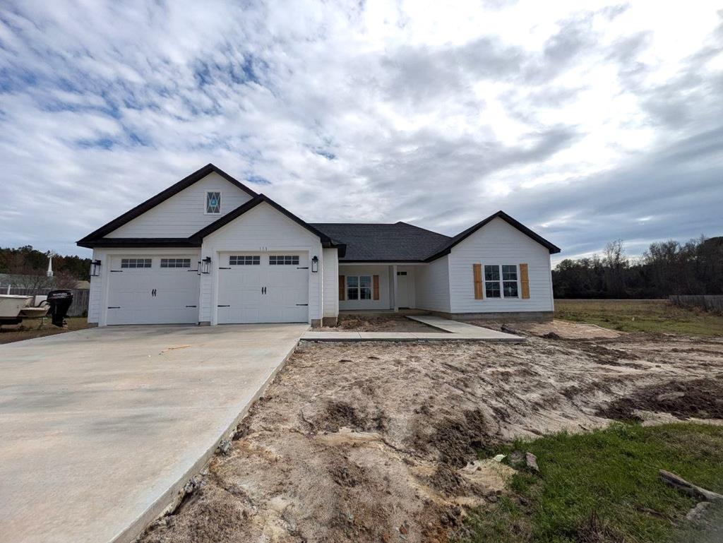 Brand new 4 bed/2 bath home located in the spectacular Southern Pointe subdivision! Ideally located, this home offers all the comforts of being close to town while still providing the space and privacy of the countryside. The front and back porches are the perfect areas to sit back, relax, and enjoy the breeze. This spacious .96 acre lot offers plenty of space for both kids and pets to run around and play. Inside the house, the soon to be impeccable kitchen is great for making meals while your kids or guests sit at the island countertop or in the living room. The trey ceiling in the living room and master bedroom gives the spaces a large and open feeling. You'll never feel claustrophobic here! The master bedroom comes with a gorgeous master bathroom that offers beautiful double vanities, a luxury shower, and a gigantic walk in closet. On the other side of the house, there are three more bedrooms which are perfect spaces for kids, an office, or for extended family when they come for a visit!