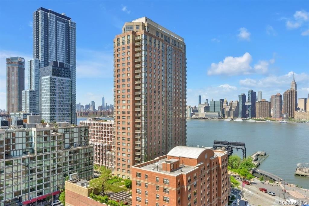 Discover urban living at its finest in this stunning 1-bedroom/convertible 2 bedroom unit located in  Citylights building, Long Island City's first luxury high-rise residence. Built in 1997, this corner unit boasts an abundance of natural light, thanks to its oversized, double-insulated windows that frame breathtaking views of the East River, Midtown Manhattan skyline, waterfront, and scenic parks. The unit offers a spacious, open layout that is perfect for modern living. This is the ultimate urban oasis, combining luxury, convenience, and style.  Residents benefit from a fully-equipped gym, complete with a weight room, workout studio, saunas, showers, and lockers. Outdoor enthusiasts will appreciate the private tennis court, while professionals can make use of the meeting room and bike storage. The building also features a full-time concierge service and a five-level indoor garage, ensuring convenience and security. Move in and become part of a vibrant community, surrounded by shops, restaurants, and local attractions. The neighborhood offers direct access to the beautiful Gantry State Park and Hunters Point South Park, ideal for outdoor activities and relaxation.stunning 180-degree views of Manhattan, Brooklyn, and Queens. It includes ample closet space, a convenient powder room, and a newly renovated kitchen with stainless steel appliances, Brazilian Cherry Hardwood Floors throughout, high ceilings, large windows, and A/C in every room. CityLights boasts a diverse, like-minded community and amenities like a terrace, tennis courts, a gym, and a kids’ playground. Long Island City offers plenty to do, with PS1 Museum, Gantry Park, and a variety of restaurants, including Casa Enrique, Tournesol and Maiella. There are multiple grocery stores and shops along Vernon Boulevard and Jackson Avenue. The building is a transportation hub with easy access to the 7, E, M, W, R, and G trains, plus ferries and quick access to both LaGuardia and JFK airports.