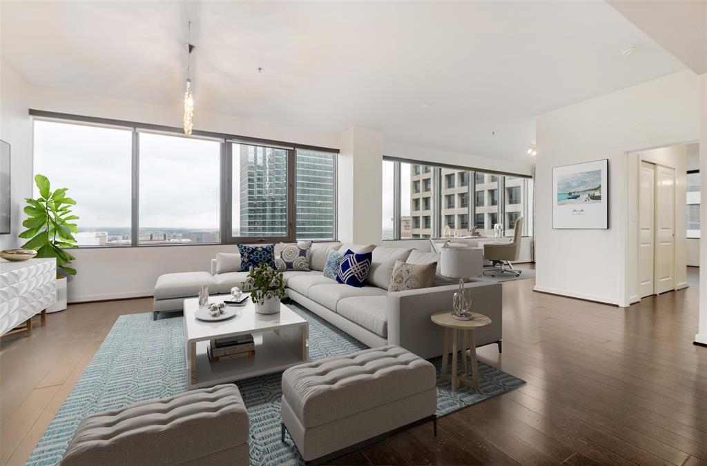 This highly coveted NW corner floor plan with a private balcony is perched on the 18th floor and has been very well maintained by the long time owner.  It offers a perfect blend of style and functionality, which makes this move-in ready home a must see!!!  Freshly painted throughout in 2026.  Newer kitchen appliances and water heater.  Enjoy the spectacular views of Downtown Dallas from all rooms and from your private terrace.  Upgrades include engineered wood floors throughout (no carpet), solar shades, newer kitchen appliances with GAS cooking, AT&T fiber optic internet wiring.  Two assigned parking spaces (tandem 235 A&B) along with storage room #1015-S (approx. 25sf) will convey with sale.  The Metropolitan is an amenity rich building that includes 24-7 Concierge, hobby-craft room, recently renovated theater on mezzanine level, conference room, community room, gym, grill area, recently renovated pool-spa & beautifully landscaped outdoor living areas located on the sixth floor.  Walk to the AT&T Discovery District, Dallas Arts District, the flagship Neiman Marcus and multiple entertainment & restaurant venues.  Attention dog lovers:  The Metropolitan is located next to Civic Garden Park where a new dog park is being built and is scheduled to open by Fall of 2026.  The DART train to both airports and the greater Dallas area is located just two blocks away.  The Metropolitan offers urban living at its finest in the heart of Downtown Dallas.  This sophisticated home is ready for you to move-in and enjoy right now!!!