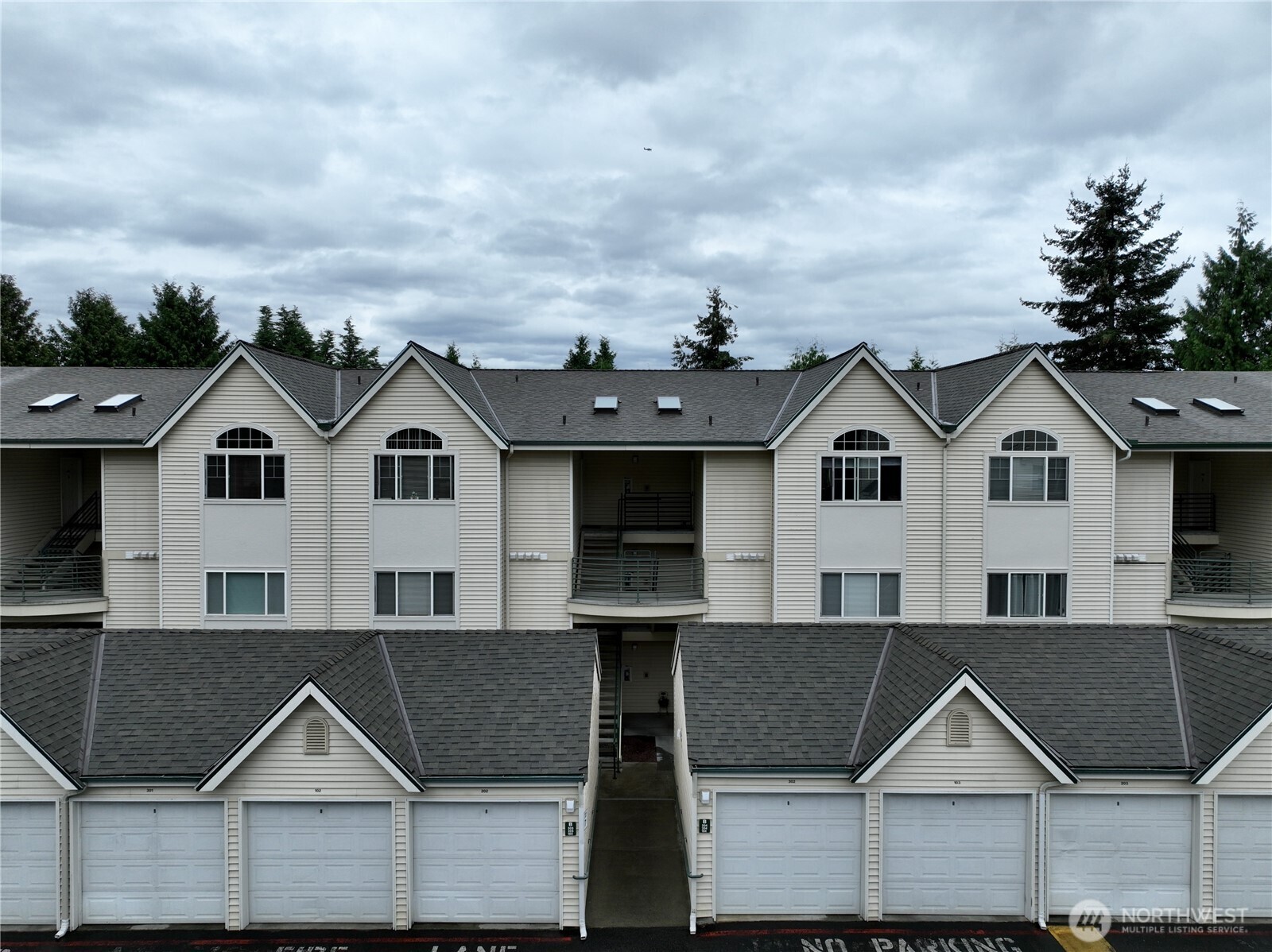 Welcome to Rivers Edge in Renton! This well maintained, top-floor condo offers 2 bedrooms and 2 bathrooms, thoughtfully combining comfort, convenience, and classic style within a gated community with detached garage parking. Step inside to discover spacious rooms, vaulted ceilings, and a bright, open-concept layout designed for comfortable living and effortless entertaining. The generous primary suite offers a private balcony - an ideal spot to unwind and enjoy a little outdoor space. Additional features include in-unit laundry, extra storage, and direct balcony access from the living room. The community has also been thoughtfully maintained and recently improved, with new roofs on both the residential and parking structures, fresh asphalt throughout the complex, and an upgraded gated entry system. It's conveniently located only minutes away from the Landing and other nearby amenities! This could be yours to call home.