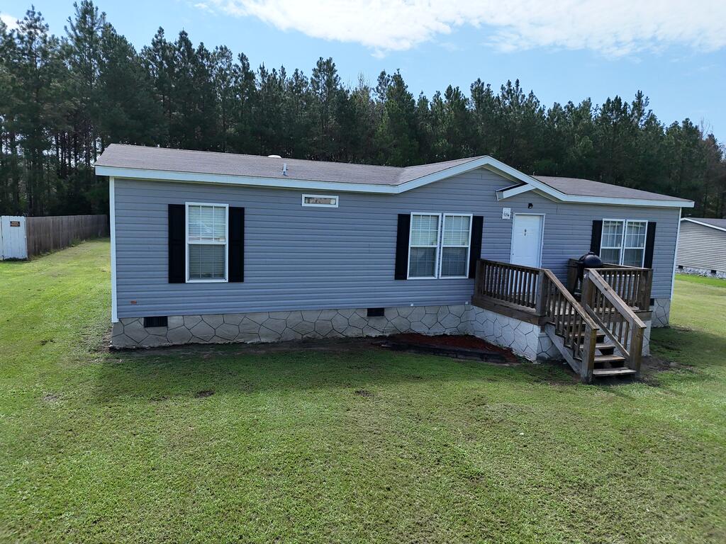 Home offers a functional floor plan with an open kitchen and living area, a split floor plan with a primary suite and two guest bedrooms, and two full bathrooms. The property offers an easy, scenic drive into Thomasville while being just minutes from Boston. Outside, you'll find a large yard, outbuildings with room for your toys, and plenty of space to enjoy the outdoors. Just steps outside your door are miles of beautiful South Georgia backroads and dirt roads winding through the countryside. Eligible for FHA financing with low down payment options.  Click here for virtual tour: https://my.matterport.com/show/?m=agimR2sr6G4&mls=1