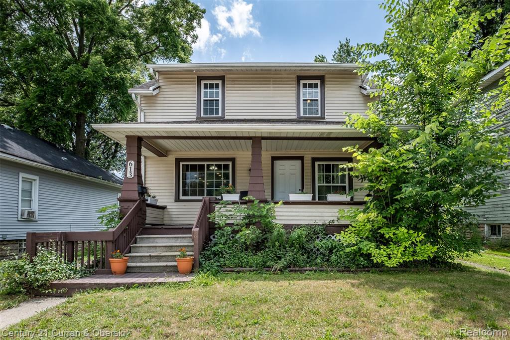 WELCOME HOME! COZY BUNGALOW WITH HISTORIC CHARM AND OPEN FLOOR PLAN. CONVENIENT LOCATION--only a 7-minute drive to Michigan State University! 3/4 mile to River Walk downtown, one mile to Kroger and walking distance to Reotown.  Functional, open floor plan. Dining area open to Living Room and long Galley Kitchen with ample cupboards for storage, counter space and classic French Doors leading to backyard. Kitchen also features a substantial amount of recessed lighting and a built-in coffee bar. Some big-ticket items have been taken care of for you! New roof--2018; New windows--2021; New AC--2022; Painting-2022; Hot Water Heater--2012; Hard Wood Floors under carpet.  3 bedrooms (one currently used for office space); convenience of 2 full baths--one on main floor, one on upper floor.  Room for extra storage in basement.  Detached garage to keep snow off your car in the winter. Appliances stay.  Whether you are a potential student, teacher, or are just wanting a Lansing location, this is a great home for an affordable price close to all things Lansing.