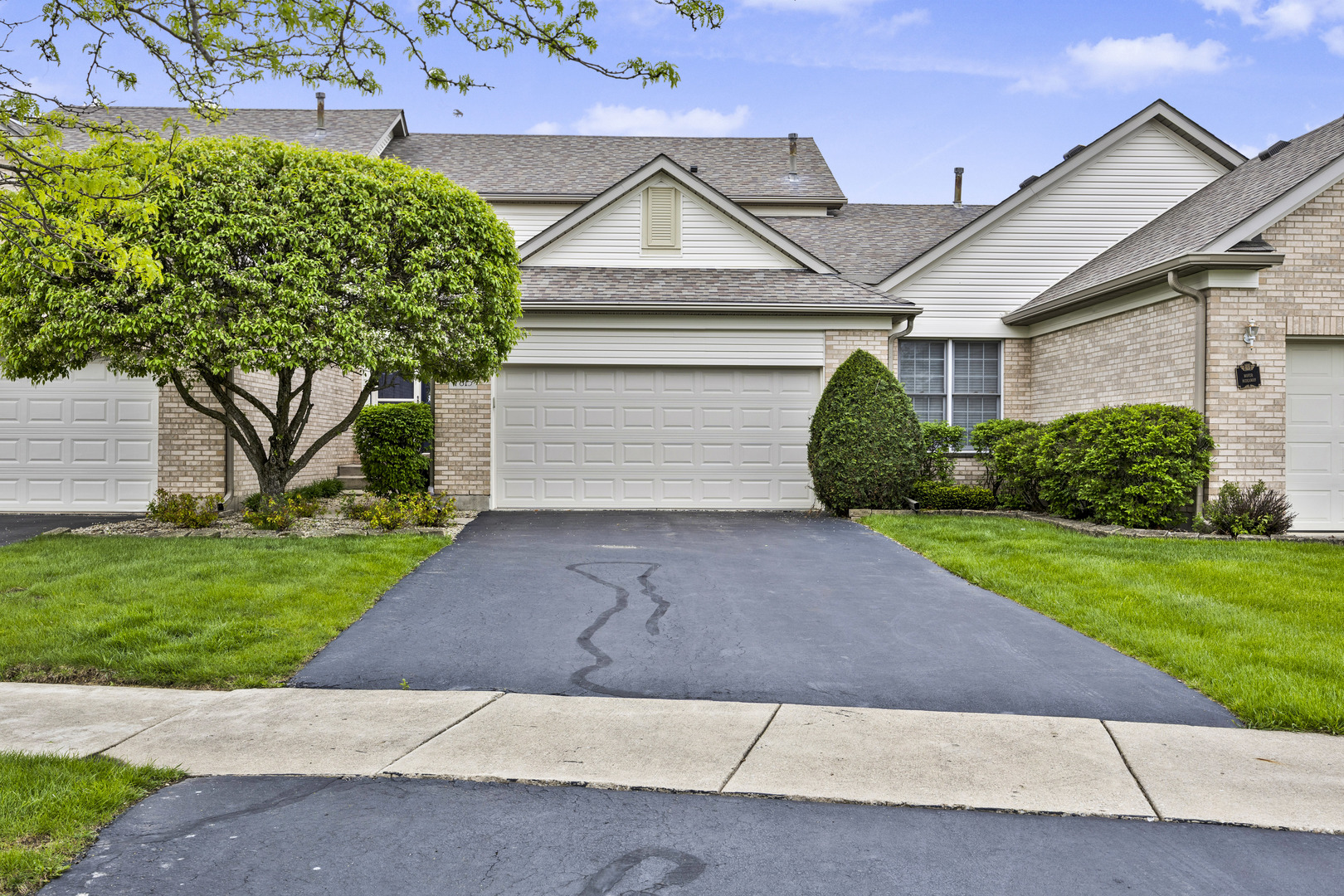 Welcome to 7815 Bristol Park North - a well-maintained two-story townhome with a full basement and 2-car attached garage.  The home has 2 bedrooms and 2.5 bathrooms.  Enter into a two-story foyer with beaming natural light which leads to the living room with a gas burning fireplace and eat-in kitchen.  The primary suite has a walk-in closet and full bathroom with double vanity and walk-in tub/shower.  The other bedroom is also on the second floor along with a loft area.  The full basement is well configured to easily transform it into more living area.  The interior of the home is warm and welcoming, but what's outside is just as appealing.  There are no neighbors across the street, only a park with plenty of open space and a walking trail.  Through the patio door in the rear of the home is a semi-secluded backyard, great for relaxing or entertaining.  The home is well located and within two miles of the: Metra station, library, highway access, Downtown Tinley Park and plenty of retail/shopping. The home is within school districts 140 and 230.  Many items have been replaced over the years: roof (2017), furnace (2012), central air (2012) and some of the windows in 2014.  The home has been well cared for and being sold As-Is.