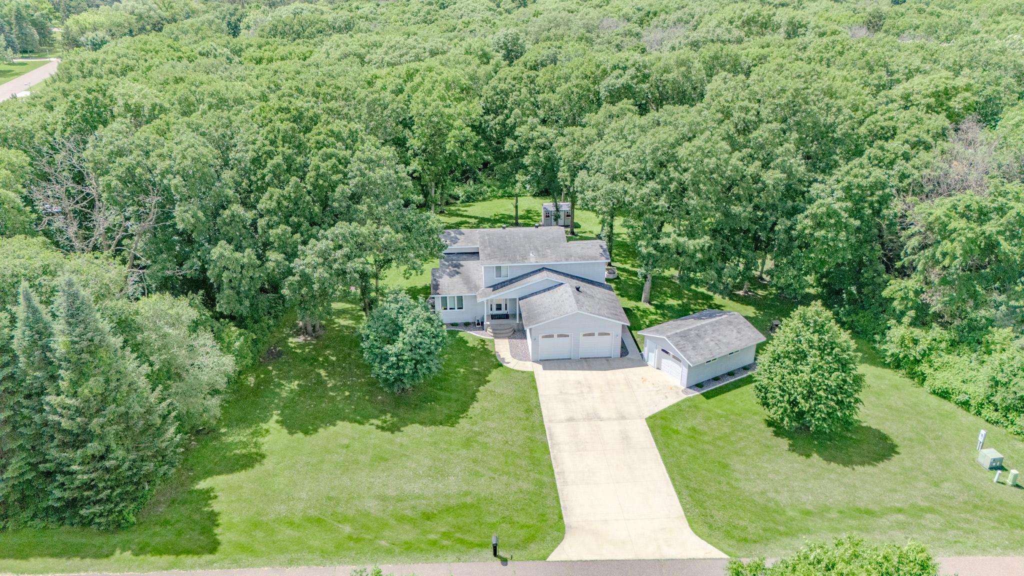 Spacious home, lot and garages on this custom built home on the edge of town!  3 bedroom 2.5 bath currently with options for up to 5 bedrooms if needed!  Heated and finished attached garage plus extra detached garage, large deck overlooking the private wooded 1.2+ Acres!  Stately home with great curb appeal, plenty of space to entertain in the multiple dining and living spaces, 3 upper level bedrooms with 2 bathrooms including a primary bedroom ensuite and Walk In Closet room!  Bonus rooms, many upgrades & updates over the years! Enjoy comfort and space inside out - meticulously maintained, Most furniture can be included/negotiated, you can move right in!