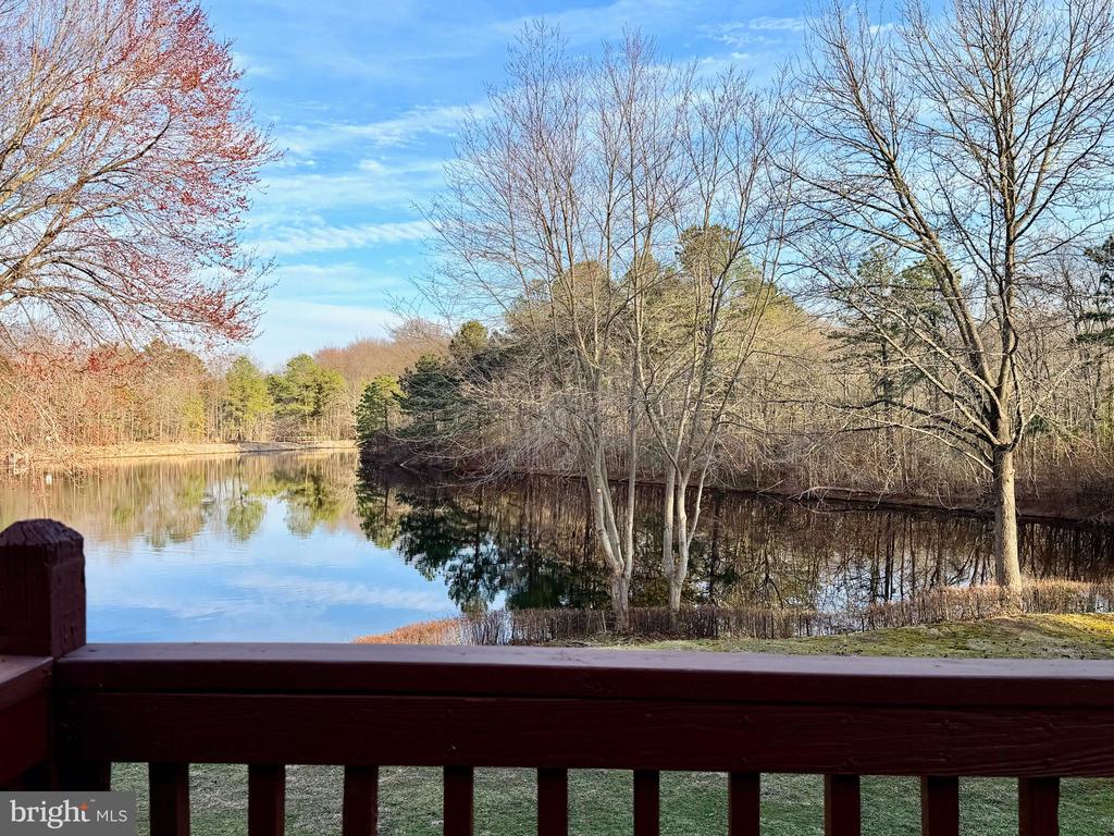 A perfect lakeside retreat!This bright and inviting 2-story townhome offers comfort, style, and breathtaking lake views from nearly every angle.Step inside to a beautifully maintained, light-filled interior featuring gleaming hardwood floors throughout. The spacious living room showcases soaring vaulted ceilings and large updated windows that frame serene water views—allowing you to enjoy the changing seasons from the comfort of your home. A Pella sliding glass door opens to the rear patio, the perfect spot to relax with your morning coffee or unwind at sunset by the lake.The main level offers a seamless flow, including a dedicated dining area and a functional galley-style kitchen. A convenient powder room, laundry/utility/mud room, and access to the one-car garage complete the first floor.Upstairs, an open landing overlooks the living space below and leads to two generously sized bedrooms with ample closet space. The primary bedroom features sliding doors to a private balcony with tranquil lake views—your own peaceful escape—along with a spacious walk-in closet and an additional double closet. A full bathroom with a tub/shower combination is shared with the second bedroom. A skylight above the staircase fills the space with natural light.Major updates provide added peace of mind:Roof (2014),Siding (2019),Windows & Pella sliding doors (2010), Hot water heater (approx. 5 years old).Enjoy low-maintenance living with exterior upkeep handled for you, giving you more time to take advantage of community amenities, including walking and hiking trails, pool, tennis, pickleball, and basketball courts.Ideally located just minutes from major highways, popular dining, and premier shopping, with easy access to Philadelphia and the Jersey Shore.Move right in and start enjoying the lifestyle you deserve in this beautiful lakeview home!**