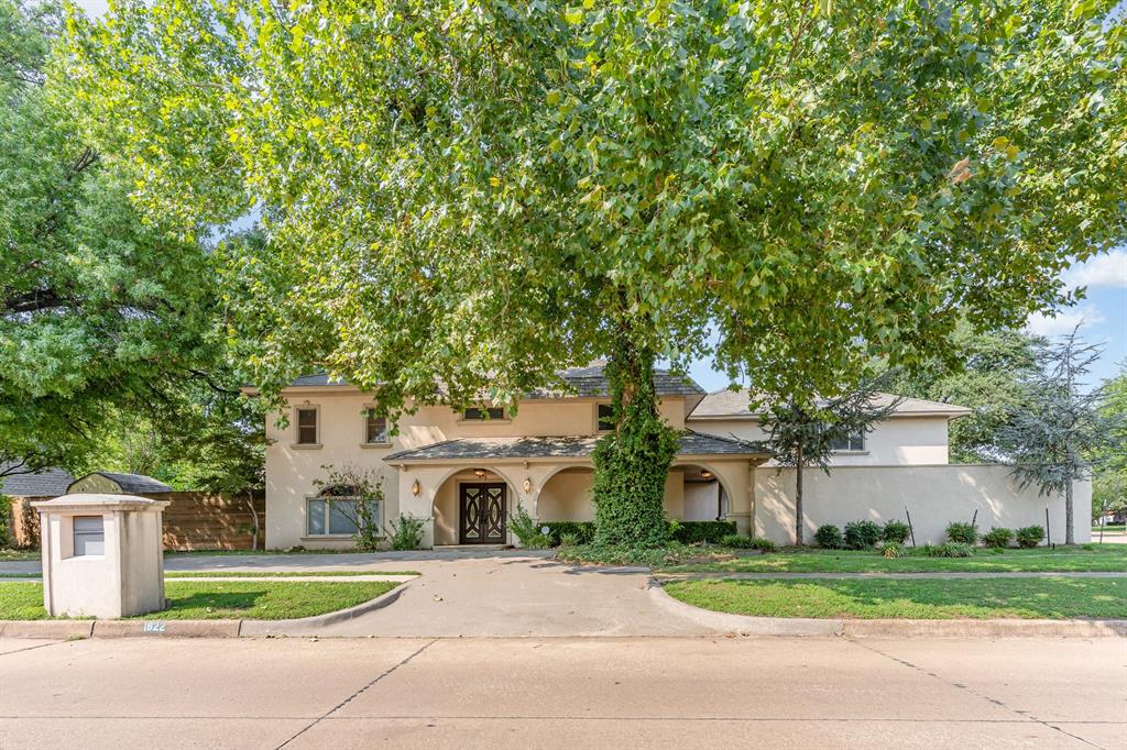 Elegant Mediterranean Estate on a Prime Corner Lot in Brookhaven Addition! This beautifully designed more than 4,000 sf inspired home sits on a spacious .34 of an corner lot in one of Norman’s most established neighborhoods. From the moment you arrive, the stucco exterior, wraparound covered porch, and private courtyard make a lasting impression. Featuring two driveways & ample parking, the home is perfect for entertaining. Inside, a grand entryway welcomes you with soaring ceilings, a dramatic staircase, and a striking chandelier. The main living area features a floor-to-ceiling stacked stone fireplace, rich built-ins, & wet bar with beverage fridge—a perfect centerpiece for hosting or relaxing. The gourmet kitchen is a chef’s dream with 4-inch granite countertops, bar seating, a commerclial-grade refrigerator, breakfast area, & seamless flow into a formal dining room—ideal for gatherings & get togethers. The first floor offers a private guest bedroom with a full bath, tucked away for comfort & convenience. Upstairs, the primary suite is a true retreat, large enough for a sitting area or personal lounge. The spa-like bath includes heated floors, dual vanities, a jetted soaking tub, separate walk-in shower, & a custom-designed closet with LED lighting, mirrors, & a private laundry room. A loft-style second living area overlooks the foyer, creating a sense of openness. The 2 additional upstairs bedrooms are connected by a stylish Jack-&-Jill bathroom with granite counters, LED mirrors, heated floors, & designer tilework. The large office can be used as a 5th bedroom. The backyard offers a private oasis with a concrete pool, Jacuzzi, cedar pergola, and 8-ft privacy fence. The electric gated entry adds both security & curb appeal. Upgrades include an impact-resistant roof, & just across the street, enjoy direct access to a beautiful park with walking trails. A rare opportunity to own luxury, space, & convenience—schedule your private showing today!