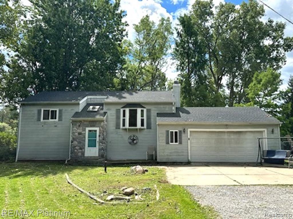 INVESTOR SPECIAL! Amazing opportunity for some sweat equity. Great large lot and prime location close to everything. 3 bedroom, 2 full baths. Home features a new roof, newer flooring in lower level, newer well pump, newer water heater, newer garage door, some newer windows w/warranty. Remodeled bathroom. Private back yard is a nature lovers dream. Do not miss out, priced to sell! SOLD AS-IS. Schedule your showing today
