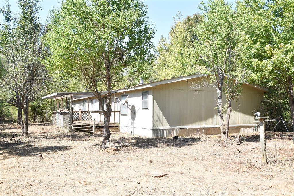 Looking for acreage, privacy, and plenty of space to make your own? Welcome to 8925 Sebastian Road in Keithville, where this spacious 4 bedroom, 2 bath manufactured home sits on approximately 5.6 acres in a quiet country setting.Built in 1995 and offering approximately 2,240 square feet, the home features a generous floor plan with multiple living areas, a large kitchen with abundant cabinetry and a center island, and a living area featuring a stone fireplace with built-in cabinetry. Four bedrooms provide plenty of space, while the primary suite includes a private bath.A long driveway leads back to the home, creating a sense of privacy and separation from the road. Mature trees surround the property, and the acreage provides plenty of room for outdoor activities, gardening, equipment, recreational use, or simply enjoying the peace and quiet of country living. There's also a back patio deck area for additional outdoor space.The home needs TLC and updating and is being offered with its current condition in mind, making this an opportunity for a buyer who isn't afraid of a project and wants to add value through improvements.With 5.6 acres, 2,240 square feet, four bedrooms, two full baths, and a peaceful Keithville location, 8925 Sebastian Road offers plenty of room and potential to create something special.Bring your vision and make this property your own!I think this positioning is stronger than simply calling it a fixer upper. You're really selling 5.6 acres, privacy, 2,240 SF , 4 bedrooms ,upside. The condition explains the opportunity rather than defining the property.