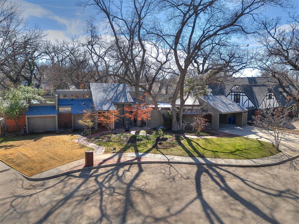 Welcome to 1012 Nottingham Circle — a rare architectural treasure where mid-century modern design meets today’s luxury living.Originally owned by architect Ben Graves, this home is filled with timeless character: soaring ceilings, floor-to-ceiling windows, and a design that connects indoor and outdoor spaces. Over the past two years, the home has been transformed through a complete renovation — blending modern functionality with its architectural roots.Inside, you’ll find 4,204 sq ft (per appraisal) of beautifully reimagined living space. The heart of the home is a stunning chef’s kitchen, featuring custom walnut cabinetry, a dramatic quartz island, gas range, and walk-in pantry with a built-in coffee bar. Just off the kitchen, a sunlit garden room with its own climate control offers the perfect spot for morning coffee, a yoga practice, or simply enjoying the view year-round.The layout is designed for flexibility:• A sprawling 730 sq ft loft for a home office (or two), second living area, or creative studio.• A renovated master suite with spa-like finishes.• An additional ADA-compliant bathroom, thoughtfully designed for multi-generational living or guests.Step outside to a show-stopping yard with professional landscaping, Japanese maples, perennials, and mature trees. Entertain on the expansive deck, relax under the 200 sq ft gazebo with new electrical and fixtures, or simply enjoy the privacy of the cedar shadowbox fence surrounding the property.No detail has been overlooked — from new hardwood floors, new roof, and upgraded electrical, to a brand-new sewer line, hot water heater, sprinkler system, and LED lighting throughout. This is truly a turnkey architectural gem: a rare opportunity to own a custom mid-century home that’s been carefully restored and modernized for today’s lifestyle.