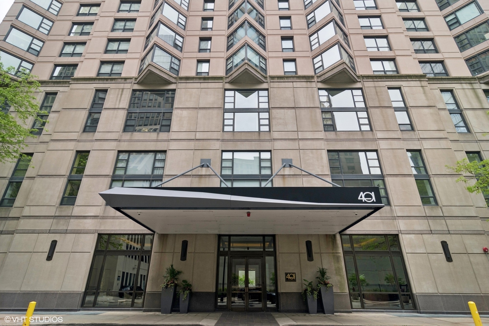 Designer renovated 2 bed 2 bath condo in the heart of Streeterville. Welcome to Residence 1202 at 401 E Ontario - a truly sophisticated condo in a premier full-amenity building with garage parking included. This gorgeous home has been thoughtfully reimagined with every detail in mind - eclectic grandmillenial style, high-end finishes, and modern conveniences throughout. Step into a sun-drenched corner unit featuring all-new wide-plank flooring, elegant custom millwork and moldings, custom lighting and window treatments that frame the city views. The spacious living area centers around a show-stopping custom fireplace wall with built-in TV, offering a perfect blend of comfort and contemporary flair.  The defined dining space surrounded by windows offers plenty of seating. The sleek, upgraded kitchen boasts new marble countertops, a new refrigerator and microwave, and refined cabinetry-ideal for everyday cooking and entertaining alike. Both bathrooms have been fully redone with modern vanities, designer tile, and high-end fixtures, including luxe gold rainfall shower heads for a spa-like experience. Additional upgrades include added storage and closet systems, providing exceptional organization and function.  Building amenities include 24-hour door staff, indoor pool, jacuzzi, two expansive sun decks, resident lounge, a fully equipped fitness center, sauna, and on-site management. Located just one block from Lake Michigan, the lakefront trail and beach, steps to Navy Pier, Whole Foods, Trader Joes, restaurants, coffee shops, movie theatre, museums, and transportation. Don't miss this rare opportunity to own a fully upgraded residence in one of Chicago's most sought-after neighborhoods.