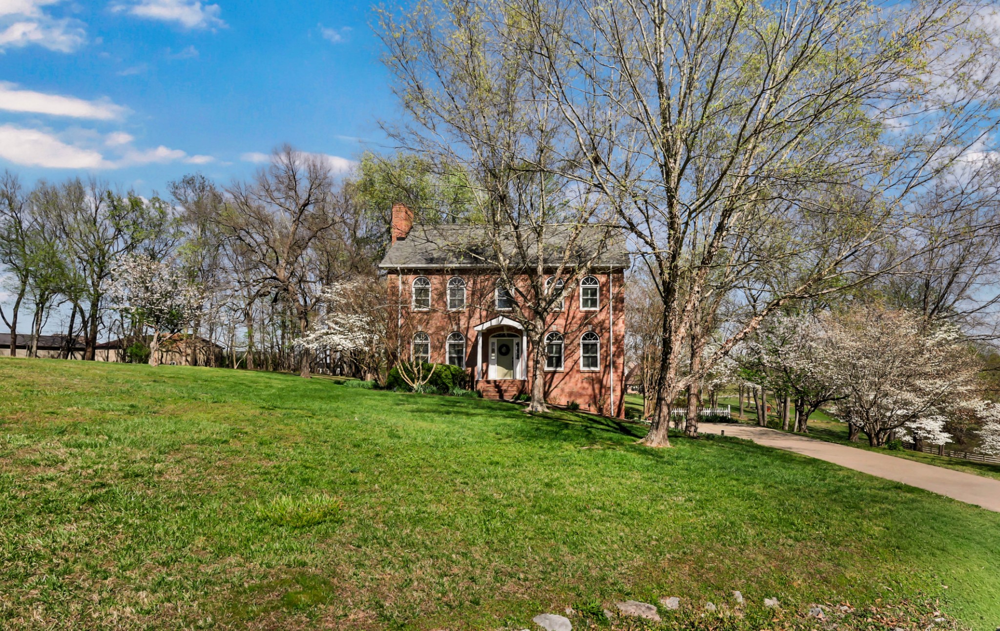 Welcome home to 930 Doe Run Ct—where timeless style meets thoughtful updates. Nestled on 1.68 acres with mature trees and standout curb appeal, this home makes an impression from the start. Step inside to a soaring entry foyer with rich hardwood flooring and elegant glass-paneled doorways. The spacious living room features a gas fireplace with brick surround, while the open kitchen offers a center island, granite countertops, pantry, bar area with mini fridge, and a generous dining nook. A formal dining room provides the perfect space for gatherings. The main level also includes a beautifully renovated powder room and a functional laundry room with sink and extra storage. Upstairs, you’ll find three bedrooms and two full baths, including a spacious primary suite with a fully renovated en suite featuring a freestanding soaking tub, tiled walk-in shower with glass doors, double vanities, private water closet, and walk-in closet. Secondary bedrooms are generously sized, each with walk-in closets, and the guest bath has been tastefully updated. The basement offers a finished flex room with walk-in closet, a two-car garage, and additional storage space. Outdoor living shines with a multi-level (4-tier) deck designed to enjoy the scenic views year-round—complete with a heater, awning, stair lights, and patio space below. Additional storage is tucked beneath the deck. Plantation shutters throughout will remain. This home has been meticulously maintained and truly cared for.