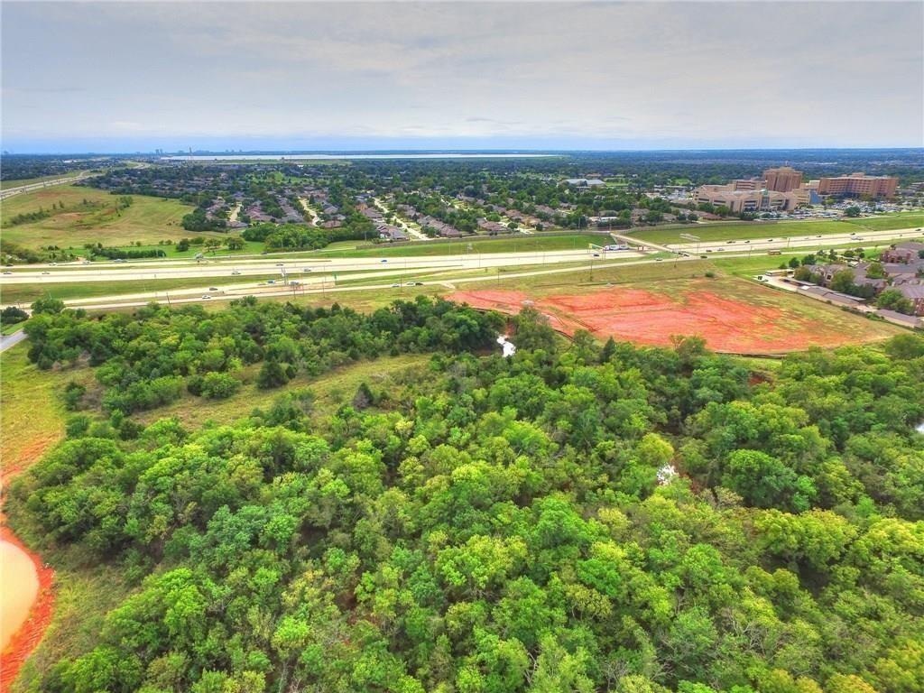 LOCATION, LOCATION, LOCATION....21 acres on Memorial right across from Mercy Hospital. Zoned (PUD-1627)- Commercial, Office, Child Care, Restaurant, Multi-Family.. Owner Financing (option).. Appraised for $2.25MM.. Owner willing to partner up on a development.