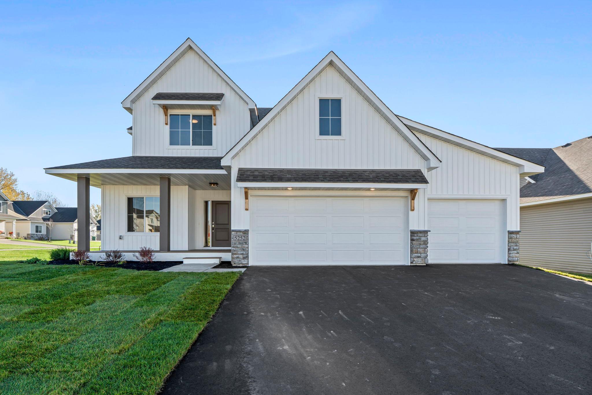 Welcome to this exquisite two-story home that seamlessly blends timeless craftsmanship with modern comfort. Custom built by Stone Cottage Construction, “The Evergreen” floor plan offers open-concept living with an abundance of natural light and high-end finishes throughout. The main floor features a spacious kitchen with quartz countertops, a large center island, tiled backsplash, soft-close cabinetry, and stainless steel appliances. Adjacent is the dining room, ideal for both everyday meals and entertaining. The living room boasts a cozy gas fireplace and oak hardwood floors. A large mudroom with Luxury Vinyl Tile flooring connects the home to the 3-car garage, offering practical and stylish storage. Upstairs, the serene primary suite includes a ¾ ensuite bath and a generous walk-in closet. Two additional sun-filled bedrooms, a full bath, and a convenient upper-level laundry room complete the second floor. The unfinished basement offers endless potential for customization. Outside, enjoy the TimberTech maintenance-free front porch, professional landscaping, and irrigation system—all located in the Pheasant Run neighborhood in Lakeville.