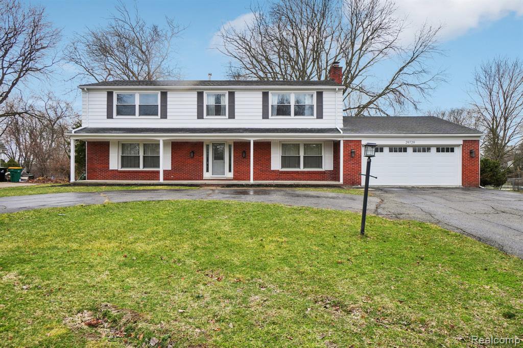 Discover this 4-bedroom brick colonial in Farmington Hills offering 2,834 square feet of bright, open living space on a beautiful lot with mature trees. Freshly painted interiors, refinished floors, and abundant natural light create a welcoming feel throughout, while thoughtful updates and outdoor features make the home ideal for everyday living and entertaining.This spacious colonial features four bedrooms and three and a half bathrooms with a layout designed for comfort and flexibility. The main living areas offer an open flow with large windows that bring in natural light and views of the surrounding greenery. A natural wood-burning fireplace adds warmth and character, creating a cozy gathering space during Michigan winters. The kitchen is equipped with stainless steel appliances and opens into the main living and dining spaces, making it easy to host family and guests. Downstairs, the fully finished walkout basement expands the living area, full bathroom and provides direct access to the backyard, offering additional space for recreation, work, or relaxation.Outdoor living is a standout feature of this property. Enjoy a Trex deck overlooking the yard, along with a stone paver patio and terrace retaining wall that create multiple spaces for outdoor seating and entertaining. The large backyard is surrounded by mature trees, providing privacy and a peaceful setting. Important mechanical updates include a dual heating and air conditioning system, a newer furnace and boiler, a 200-amp electrical service panel, and major exterior improvements including a roof and windows replaced in 2016. Additional conveniences include a two-car attached garage, EV charger ready and a horseshoe driveway that offers ample parking and easy access. With generous living space, a finished walkout lower level, and beautifully designed outdoor areas, this Farmington Hills colonial offers a great combination of comfort, functionality, and natural surroundings.