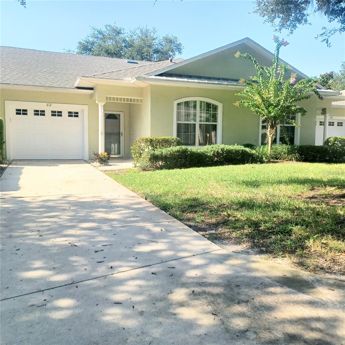 Now reduced to 257,500.00. This is truly a great price. Welcome to the sought-after community of Arbor Trace. This villa/condo offers 2 bedrooms and 2 full baths with BRAND NEW luxury vinyl planked 8mm flooring in both bedrooms, dining area, Great Room and the sunroom. Seller just spent 5,000.00 on this brand-new flooring and this flooring is beautiful. Professionally installed. All other flooring is tile. Large kitchen with Granite and lots of cabinets, counter space, pantry closet and newer appliances. Primary bath has a walk-in shower and in bedroom a large separate walk-in closet. Second bathroom was just freshly painted. Plantation shutters in sunroom across entire wall of windows. Second bedroom has a built in Murphy bed with additional storage. Very quiet and well-maintained community with streetlights, community pool and clubhouse. You have a one car garage with garage door opener and additional parking in your private long driveway. Inside condo is a laundry closet with full size washer and dryer. Bi-fold doors will be put back in place on laundry closet prior to closing. This villa/condo is in close walking distance to the large Publix shopping center where you will have numerous restaurants, doctor's office and many other stores. Hoa fee covers outdoor maintenance, cable, insurance on building, roof care, exterior building painting, pool and clubhouse maintenance, grounds upkeep (cutting grass and bushes) pest control and all common area maintenance. This condo/villa has been professionally cleaned and is in move in condition. A.C is from 2017 and just serviced in Sept. 2026. Don't miss one and we have a motivated seller. Come take a look. I think this might be the one you have been waiting for.
