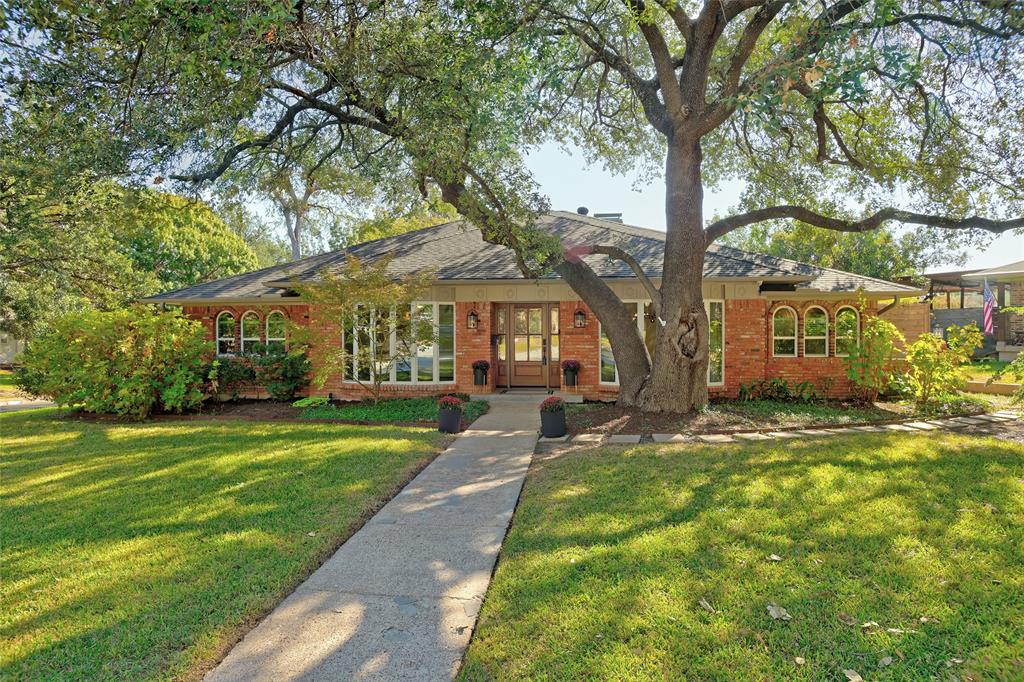The drive-up appeal says it all.  Tucked at the end of a quiet cul-de-sac on a desirable corner lot, this Lake Highlands home greets you with mature trees and the kind of attention to detail that tells you immediately: this one has been loved.  Step through the entryway and the home opens to an expansive main family living area with soaring beamed ceilings, a wall of built-in cabinets offering storage galore and a fireplace with gas logs and a hearth at its heart. Two spacious living areas, two dinning areas  and a wet bar make entertaining effortless.  Remodeled with the finest materials, the kitchen pairs quartzite countertops with a Kohler faucet, a new dish washer and designer pulls, delivering a current, polished look any cook will appreciate.  The primary bed and bath are a true owner's retreat offering granite countertops, dual sinks, separate dressing areas and two walk-in closets.  You can't miss the special touches of premium brand name fixtures and designer wallpaper.  Other recent updates include energy efficient windows and new doors with WIFI connections.  The screened-in rear porch will be a favorite place to relax.  Come visit today!