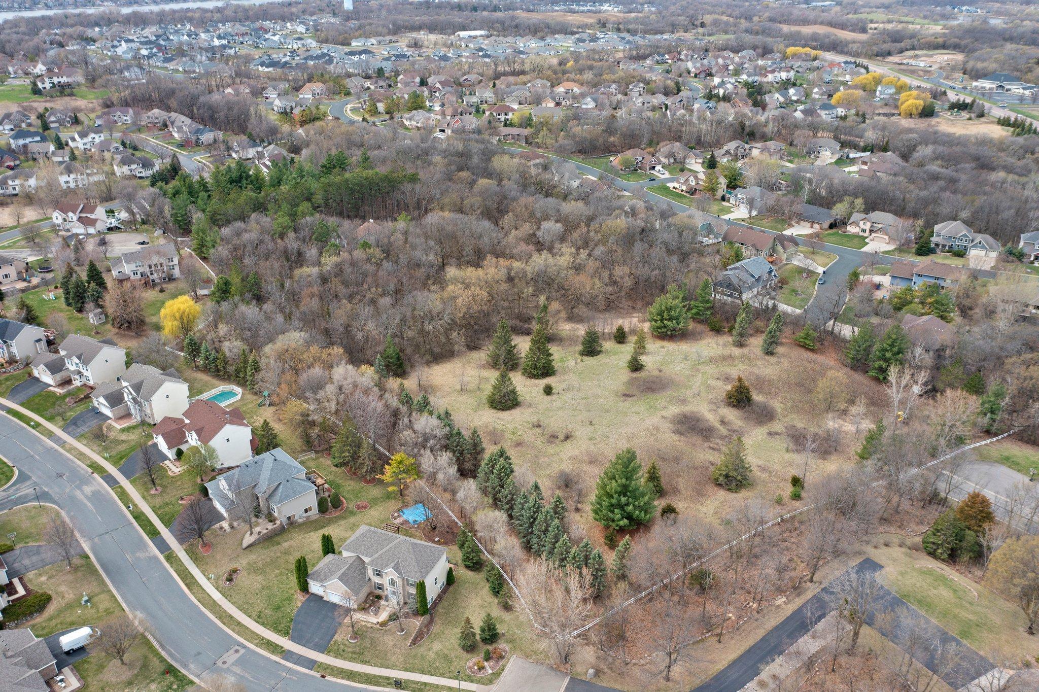 Exceptional Development Opportunity! Discover the immense potential of this 10 acre property ready for development.  This property presents the ideal canvas for creating a thoughtfully designed community. This property currently has a two story home situated in a wooded setting and surround by nature but offers a rare opportunity for residential development. There are 4 entrances to the property that the city designed for future through streets and development.  Each entrance is subbed for utilities. Access to the property is strictly prohibited without prior written permission. Unauthorized entry on the property will be considered trespassing.