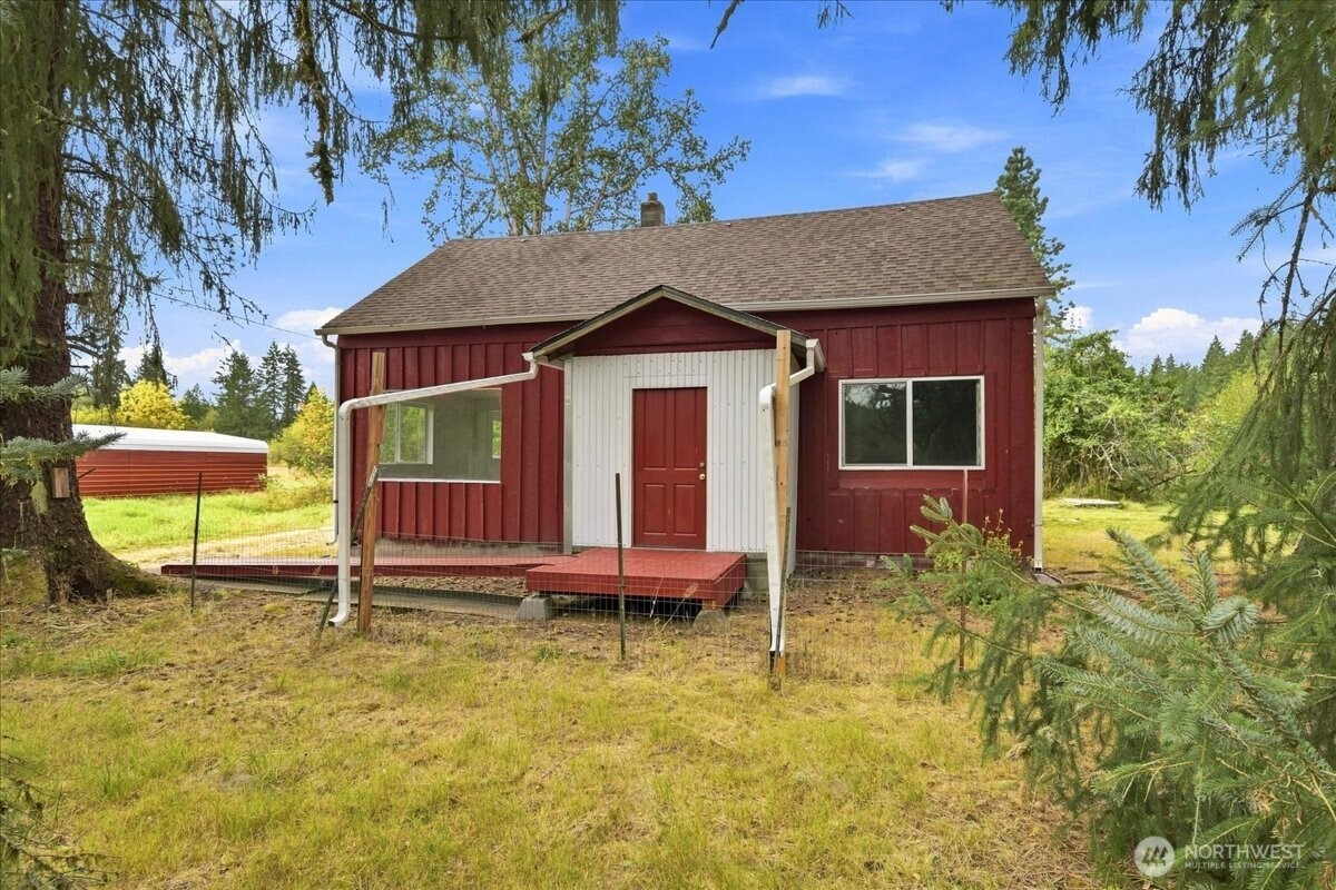 6.12 acres of peaceful country living with room to roam! This level, fenced pasture offers a versatile setup for horses, goats, chickens, livestock, recreation, and more. The refreshed farmhouse features a new roof installed in 2022, septic tank and freshly serviced well in 2025. Equestrian and livestock enthusiasts will appreciate the two spacious 24' x 41' outbuildings, offering excellent flexibility for barn space, equipment, hay, or other farm uses. There is an additional detached carport with concrete pad which provides ample covered parking. Enjoy an abundance of mature fruit trees, including apples, plums, and pears, along with a seasonal creek, territorial views, and abundant wildlife including deer. The property borders Weyerhaeuser forest land, providing access by permit to miles and miles of forest roads ideal for hiking and trail riding. Tucked away on a dead-end road, this property offers a peaceful rural setting while remaining conveniently located just 10 minutes from I-5. A rare opportunity to enjoy acreage, usable pasture, outbuildings, and privacy without sacrificing easy access to town and major routes.