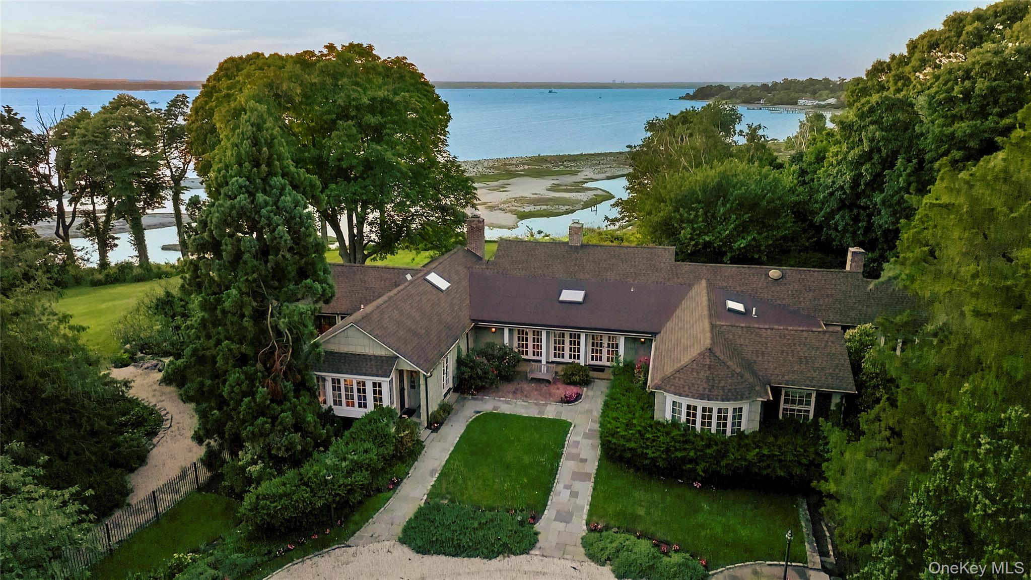 Available for the first time in nearly 50 years and one of only a handful of SP waterfront homes to offer significant acreage, 120 West Creek Farms Road allows you to experience coastal living at its best with rolling lawns, in-ground pool and expansive bluestone terraces for lounging and dining while enjoying sensational sunsets. The 4500 sf home is elevated above the flood plain and positioned to capture panoramic views from west to east. Located at the end of Sands Point's loveliest streets and surrounded by magnificently landscaped property, this home offers both privacy and easy access to the Village and to Port Washington's convenient and vibrant services and amenities.