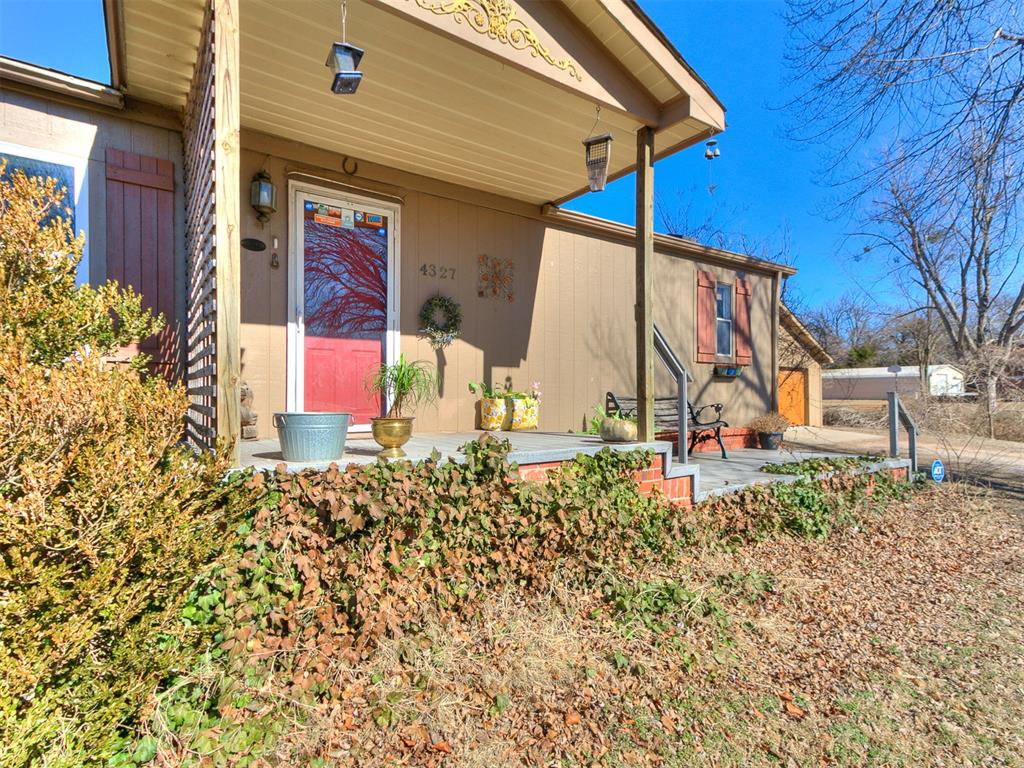 Welcome to 4327 Cardinal in Edmond, where space, versatility, and opportunity meet on 1.53 beautifully usable acres, offering the freedom of country living just minutes from Edmond amenities. The property features a well-maintained manufactured home permanently anchored to a concrete foundation with a brick exterior for added durability and curb appeal. A handicap-accessible ramp at the rear of the home adds thoughtful functionality and ease of access. The home features 3 bedrooms, 2 bathrooms, newer carpet in some areas, a new Broan vent hood, new HVAC/furnace, newer electric stove (Seller believes it is plumbed for gas if you'd like to change), water softener and a nice Bosch dishwasher. A built-on office with a wood-burning stove and new metal roof provides ideal space for remote work, a small business, or a flexible studio area. Multiple outbuildings enhance the property’s versatility, including a shop, an additional barn building (seller believes it is also plumbed for gas), and a separate two-car garage, offering excellent options for storage, hobbies, equipment, or workspace. With ample room to expand, garden, park recreational vehicles, or simply enjoy wide-open space, this property offers privacy and flexibility rarely found in Edmond. To further enhance value, the seller is offering a $5,000 credit toward flooring or buyer-selected upgrades, allowing the next owner to personalize the property. Much of the existing furniture may also remain if desired. Whether you’re seeking a peaceful homestead, a work-from-home setup with land, or a property with investment potential, 4327 Cardinal delivers space, function, and value that’s increasingly hard to find.