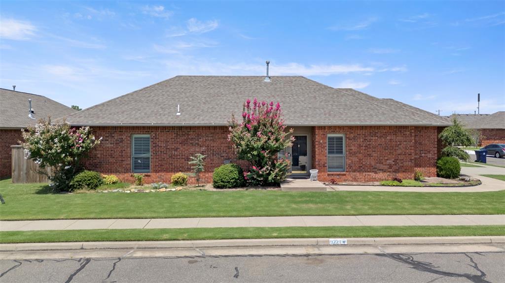 This charming 2 bedroom home is nestled within the gated Santa Fe Villas community, designed for but not exclusive residents aged 55 and older.  Bright entry opens into large living area with plantation shutters throughout the home and gas log fireplace.  Kitchen features beautiful wood cabinets, subway tile backsplash and breakfast bar.  Hugh walk-in closet w/built in dresser off primary suite.   The secondary bath is handicap accessible. Garage is slightly oversized 1 1/2 car with nice work bench, shelves for storage, as well as a decked attic.  Wired for generator as well.  Additionally, the home is located on a corner lot with the lush landscaping remains vibrant year around.  Residents benefit from the community's well-maintained amenities, including 3 fishing ponds and lawn maintenance services provided by the HOA.