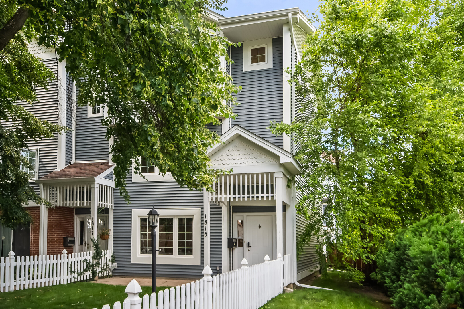 Beautifully updated 3-bedroom townhome offering exceptional space, flexibility, and convenience in Evanston. The top floor features all three bedrooms, including a spacious primary suite with an organized walk-in closet, plus a hallway bath and side-by-side laundry room.  Both baths have vaulted ceilings and skylights. The sun-filled second level showcases a large kitchen with island, dining area, beverage center with wine fridge, and access to a private deck perfect for grilling. Enjoy a generous living room with south-facing windows, gas fireplace, and built-in desk nook for working from home. The main level flex room is ideal as a family room, home office, workout space, or potential fourth bedroom. Attached 2-car garage includes a dedicated tool workstation. Private front yard and brick paver patio provide additional outdoor living space. Recent improvements include new carpet, refinished hardwood floors, new bath vanities and toilets, new washer and dryer (2024), and updated tile in the foyer and around the fireplace. Ideally located across from Evanston Plaza with Valli Produce, shopping, dining, and everyday conveniences just steps away. Easy access to both Metra and CTA Purple Line service.