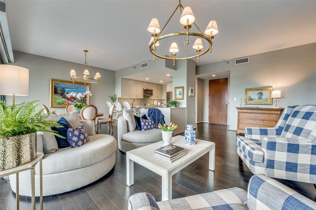 This exquisitely reimagined residence at The Warrington offers an elevated blend of sophistication, comfort, and effortless luxury in the heart of Turtle Creek. Taken to the studs and architecturally transformed, the home showcases thoughtful design, high-end finishes, and a seamless flow that enhances both everyday living and elegant entertaining. Bathed in natural light, the expansive living and dining areas feature an open-concept layout with refined detailing and generous proportions. The inviting living space is anchored by a rare fireplace with a beautifully crafted stone hearth—an uncommon and highly coveted feature in the building—creating a warm yet sophisticated focal point. The gourmet kitchen is both stylish and functional, outfitted with sleek quartz countertops, a timeless subway tile backsplash, stainless steel appliances, and a built-in wine refrigerator. Ample storage and clean lines make this space as practical as it is visually striking. The spacious primary suite offers a serene retreat, complemented by a spa-inspired bath with premium finishes and abundant storage. A well-appointed secondary bedroom and bath provide flexibility for guests or a home office, each designed with the same attention to detail and comfort. Motorized blinds throughout the home add a layer of convenience and modern luxury. Residents of The Warrington enjoy a true lock-and-leave lifestyle with an unmatched suite of amenities, including 24-hour concierge and valet services, a resort-style saltwater pool and spa, a fully equipped fitness center, and impeccably maintained common areas. Known for its exceptional service and welcoming atmosphere, The Warrington delivers a premier high-rise living experience in one of Dallas’ most desirable neighborhoods.
