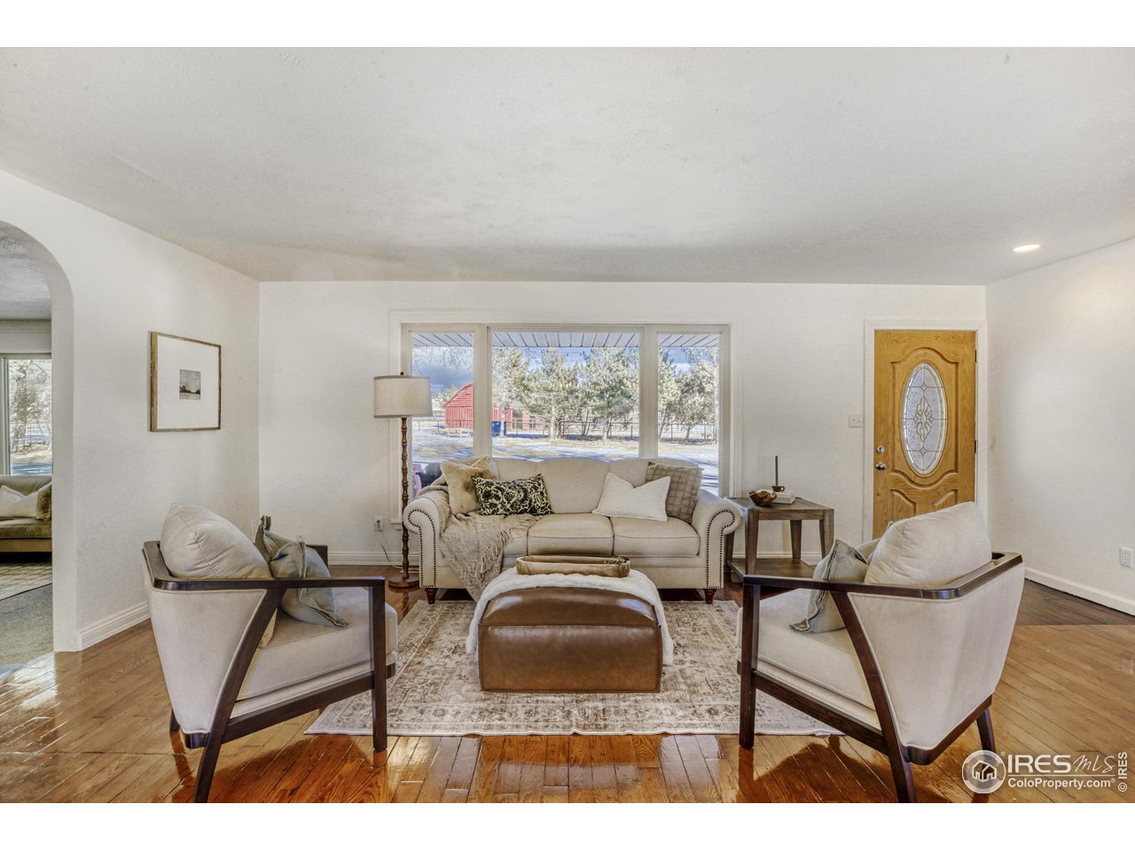 Must see for all Horse property seekers! This 3.25 ac remodeled horse property offers beautiful Mountain Views and multiple barns including an amazing large 72'x36' horse barn with 6 stalls with a 24'x12' tack room, plus an additional attached hay storage barn. All of this in addition to a beautifully remodeled ranch home in the perfect peaceful Loveland setting! Convenient location close to Horsetooth Reservoir, Bobcat Open Space, and Devil's Backbone. The property features open pasture, mature trees, multiple barns, and established fencing, providing excellent potential for horses and trailers while enjoying wide-open space and mountain views. The home features a thoughtfully remodeled main level with updated finishes, including a refreshed kitchen with updated cabinetry, countertops, and appliances. Hardwood floors, abundant natural light, and a spacious open layout with a sunken Family Room create an inviting atmosphere for everyday living and entertaining. The Dining area opens to expansive sliding doors, capturing views of the beautiful mountains out of the back of the property. Mature trees provide shade and privacy, enhancing the property's rural character with tons of opportunity in the backyard with an expansive 45'x16' composite deck and an existing water feature. This property offers the ideal combination of remodeled interior living, horse-ready land, and scenic Colorado views, all within convenient access to Loveland and Northern Colorado amenities! Updated HVAC system and water heaters including furnace and heat pump less than 2 years old.