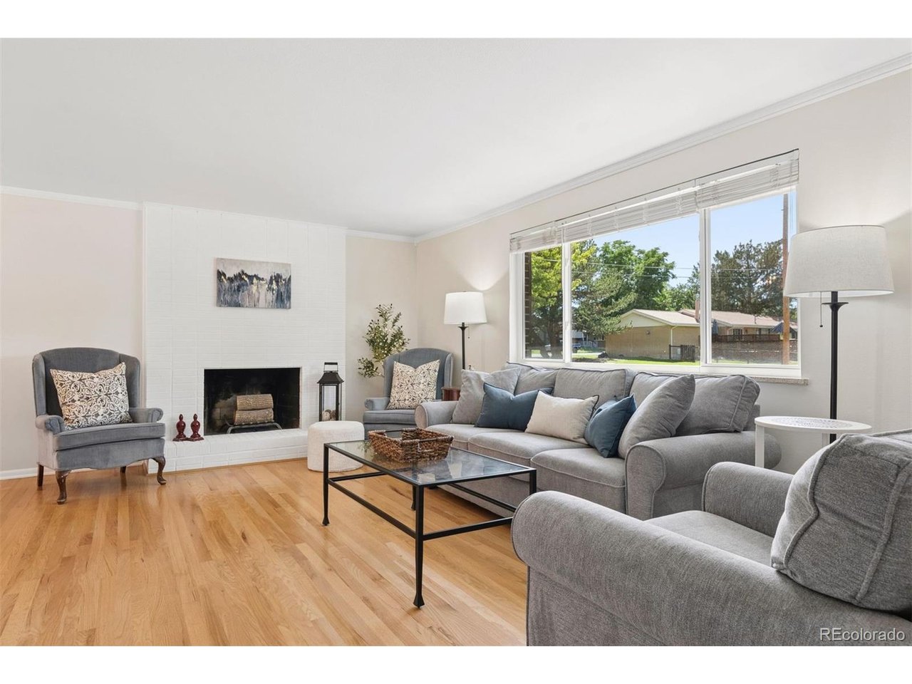 Welcome to a home that perfectly captures the appeal of mid-century living-with a thoughtful layout, timeless character, and an incredible private backyard that feels like your own secluded retreat.Tucked into a quiet, highly desirable Centennial neighborhood, this inviting home combines classic mid-century details with the space and flexibility modern life demands. Step through the front door and into a bright main level where beautiful hardwood floors, abundant natural light. Large living room has an amazing brick wood burning fireplace. Kitchen is a standout, with its cool mid-century character, generous cabinetry, and views overlooking backyard. A flexible adjoining space offers room for a breakfast nook or casual dining. The home's multi-level floor plan gives everyone room to spread out while maintaining a comfortable sense of connection. Upstairs, the private primary has great views of your huge yard! Two more spacious bedrooms and a full bath. Downstairs, the basement adds even more versatility with a large bonus area ready for a home gym, game room, creative space, office or extra storage! Step onto the spacious deck and enjoy summer dinners, and evenings with friends. Beyond it, the expansive fully fenced backyard is exceptionally private, surrounded by mature trees and offering an abundance of space to garden, entertain, let the dogs run, or simply enjoy having room to breathe. Trader Joe's and an array of shopping and dining options are so close! Scenic High Line Canal Trail is just 0.7 miles from home. Multiple parks and easy access to South Suburban Parks & Recreation nearby. With its mid-century personality, flexible multi-level floor plan, and expansive private backyard, this is the kind of home that offers something increasingly hard to find: character, space, and a setting that feels wonderfully removed from it all, while still being close to everything you need. Great Schools! Some photos are visually staged.