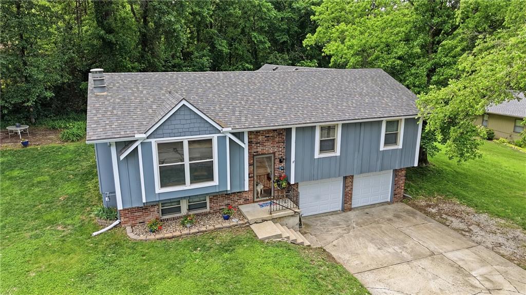 What a great introduction to lake living! Enjoy all that lake living has to offer ... fishing, skiing, relaxing evening cruises!  Lake Tapawingo is a close, inviting community with a variety of events throughout the year ... BBQ, fish fry, 4th of July Fireworks, kids fishing derby and more.  This spacious second-tier home offers five bedrooms (all on one level), four baths, and plenty of room to enjoy the lake lifestyle. The double-car garage features a tandem bay on one side — perfect for storing lake toys, a golf cart, or extra equipment. Looking for privacy? The oversized double lot with Lake Tapawingo greenspace on both sides provides a rare sense of space and seclusion. Even better, this property includes a boat dock, and a boat lift and/or boat may be available as an additional option. Lake living is truly special, and this is one you’ll definitely want to see!