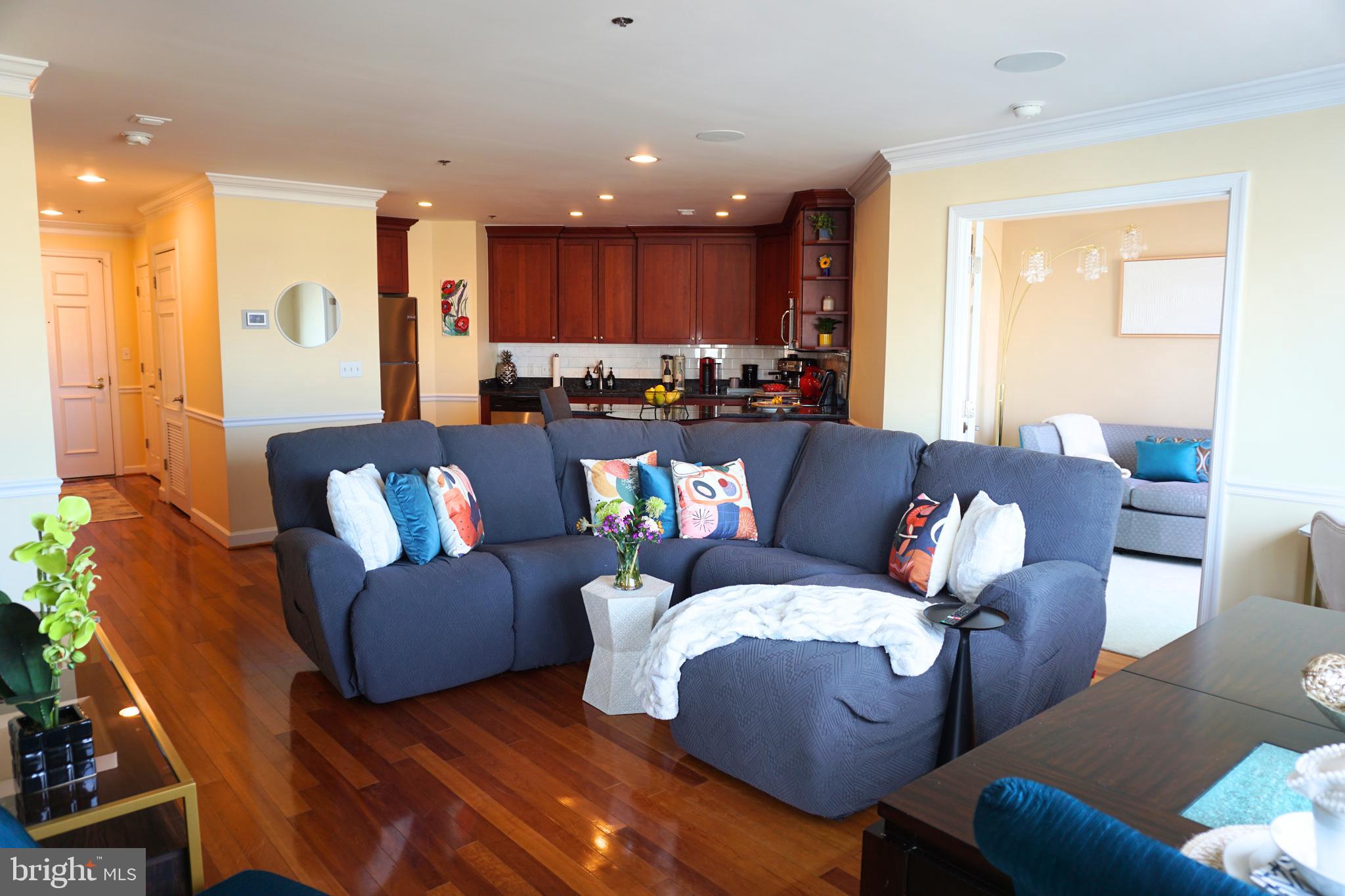 Reduced Price!!! Extraordinary Harborview Marina & Yacht Club!  The size of this unit makes for a very comfortable living space, offering two bedrooms, one full and one half bath, a Class A Kitchen with Granite counters, Stainless Appliances, Hardwood Floors throughout, and Breathtaking Views of Inner & Outer Harbor from every room.  The amenities in this building are unbelievable! Indoor Heated Olympic Pool & Extensive Fitness Center, Yoga Room, Steam/Saunas/Hot Tub Spa, Terrace for Sunning, barbecuing, reading, and pool gatherings! 24-hour concierge/security. Meeting/game rooms and guest suites. Two indoor parking spaces convey with the unit. Walk along the brick promenade to the Inner Harbor, Fells Point, and Canton. Excellent downtown location close to stadiums, shopping, gourmet restaurants, and nightlife! A Must See!