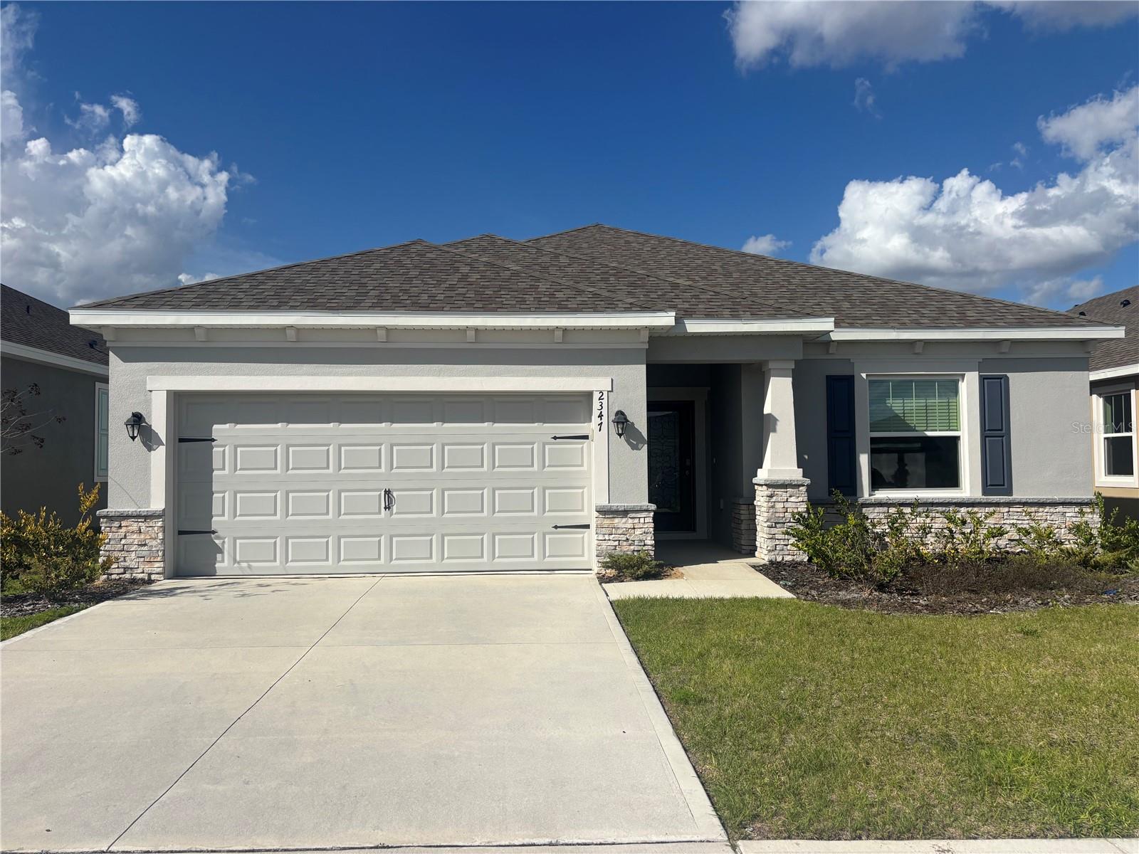 READY NOW!  MOVE IN READY! The exterior features brick stones along the bottom of the home.9'4" ceiling height, granite in kitchen and bathrooms, walk-in tile shower, 42" kitchen cabinets with crown molding.  The Jupiter is an open floor plan with great room room, big secondary bedrooms and an impressive owners suite which has a huge walk-in closet. Well appointed kitchen includes all stainless appliances, quartz countertops in kitchen and bathrooms, kitchen island overlooking the dining and great room. Indoor laundry room. 10 Year Structural Warranty,  1 year Builders Warranty & Manufacturers warranties are all included. New Dishwasher, Microwave, Range, refrigerator, washer and dryer included!
