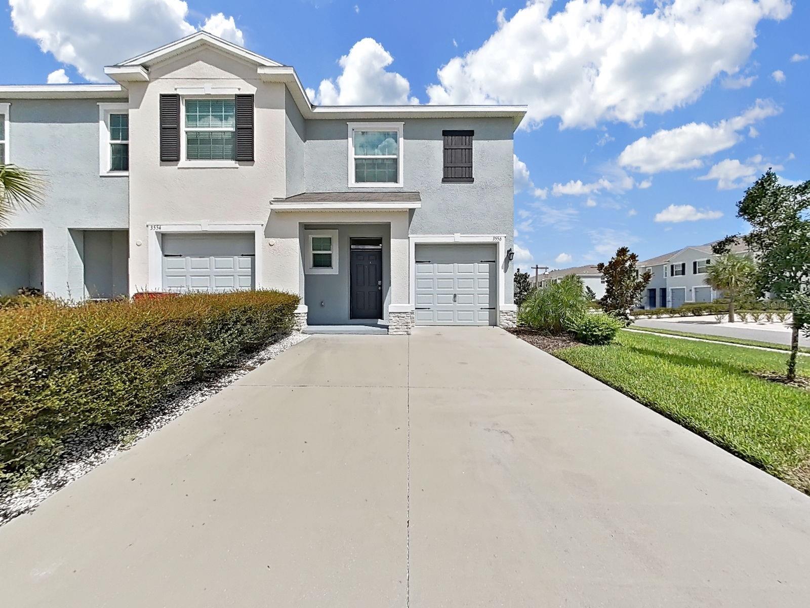 Welcome to 3556 White Dandelion Ct, a beautifully maintained 2024 built D.R. Horton townhome located in the desirable Farm at Varrea community in Plant City! This spacious two story Vale floor plan offers 3 bedrooms, 2.5 bathrooms, 1,758 square feet of living space, an open concept layout, and a 1 car attached garage. The first floor features a welcoming great room that flows seamlessly into the kitchen and dining area, creating an ideal space for everyday living and entertaining, while sliding doors provide access to the covered lanai. Upstairs, the spacious primary suite features a private bathroom and walk-in closet, along with two additional bedrooms, a second full bathroom, and a convenient laundry area. Built with concrete block construction and equipped with D.R. Horton’s Smart Home technology, this home offers the benefits of newer construction without the wait. Residents of Farm at Varrea enjoy resort-style amenities including multiple pools, a cabana, fitness center, playground, dog park, sports courts, and scenic walking trails. The community combines a peaceful, small town atmosphere with convenient access to I-4, making trips to Tampa, Lakeland, and Orlando more convenient. The home is zoned for Knights Elementary, Marshall Middle, and Plant City High School. Enjoy nearby shopping, dining, and entertainment, including historic Downtown Plant City, local restaurants such as Smokin' Aces BBQ & Steakhouse Plant City and Keel Farms Agrarian at Keel Farms, outdoor recreation at Medard Park/ Hillsborough County Parks, family fun at Dinosaur World, and the world-famous Florida Strawberry Festival, which brings concerts, carnival rides, agricultural exhibits, vendors, and entertainment to Plant City each year. With modern construction, desirable community amenities, a convenient location, and easy access to everything Plant City has to offer, this home is an excellent opportunity for anyone looking to enjoy the best of Central Florida living.