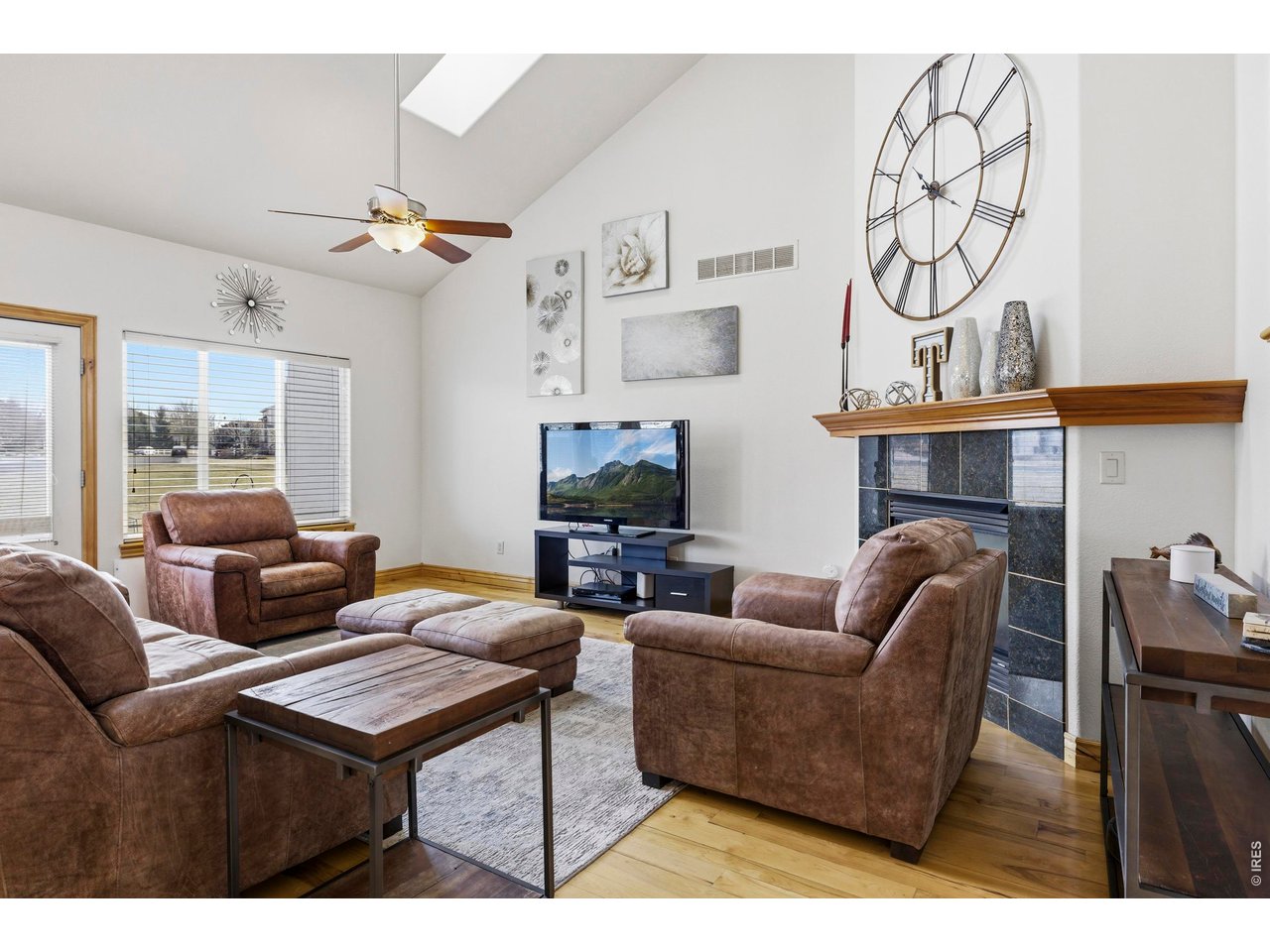 Nestled on a quiet cul-de-sac corner lot, this beautifully updated home offers a rare combination of space, comfort, and location. Sunlight fills the vaulted main level, where hardwood floors and a gas fireplace create an inviting atmosphere. The kitchen is both functional and stylish, featuring granite countertops, a gas range, double ovens, and a dedicated dining area perfect for entertaining. A private main-level study with French doors provides a comfortable work-from-home option or cozy reading retreat.The primary suite is a true standout, with vaulted ceilings, a two-way fireplace, and a luxurious five-piece bath designed for relaxation. Upstairs, a bright loft offers flexible space for a second office, play area, or media nook. The finished basement extends your living options with a wet bar, built-in entertainment center, gas fireplace, and two additional bedrooms-ideal for guests or extended family.Thoughtful updates include newer water heaters, furnace, air conditioner, and roof for added peace of mind. Step outside to enjoy a private backyard that backs to community greenspace, complete with upgraded fencing and two spacious patios tailored for outdoor living. Perfectly located near golf, tennis, pickleball, parks, and scenic trails, this home seamlessly blends easy comfort with an active Colorado lifestyle