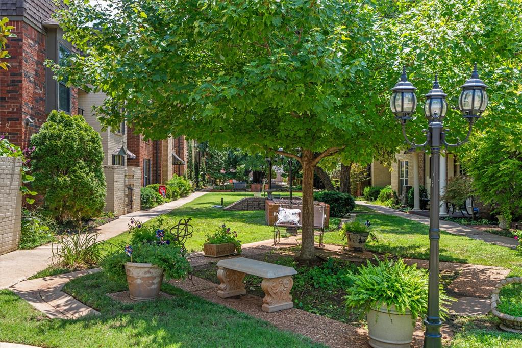 Thoughtfully updated and beautifully maintained, this Wilshire Square townhome offers nearly 2,000 square feet of refined, low-maintenance living in a prime central Oklahoma City location. Rich wood floors bring warmth and continuity to the main living spaces, while the renovated kitchen features quartz countertops, a new sink and faucet, updated hardware, and a new dishwasher. The expansive primary suite includes additional space ideal for a private office, workout area, or quiet sitting room. A second bedroom with its own bath provides comfortable accommodations, and all two-and-one-half bathrooms have been beautifully updated. With generous proportions, a fireplace, and convenient access to Nichols Hills-area shopping, dining, and major thoroughfares, this two-bedroom townhome pairs timeless comfort with an effortless city lifestyle.