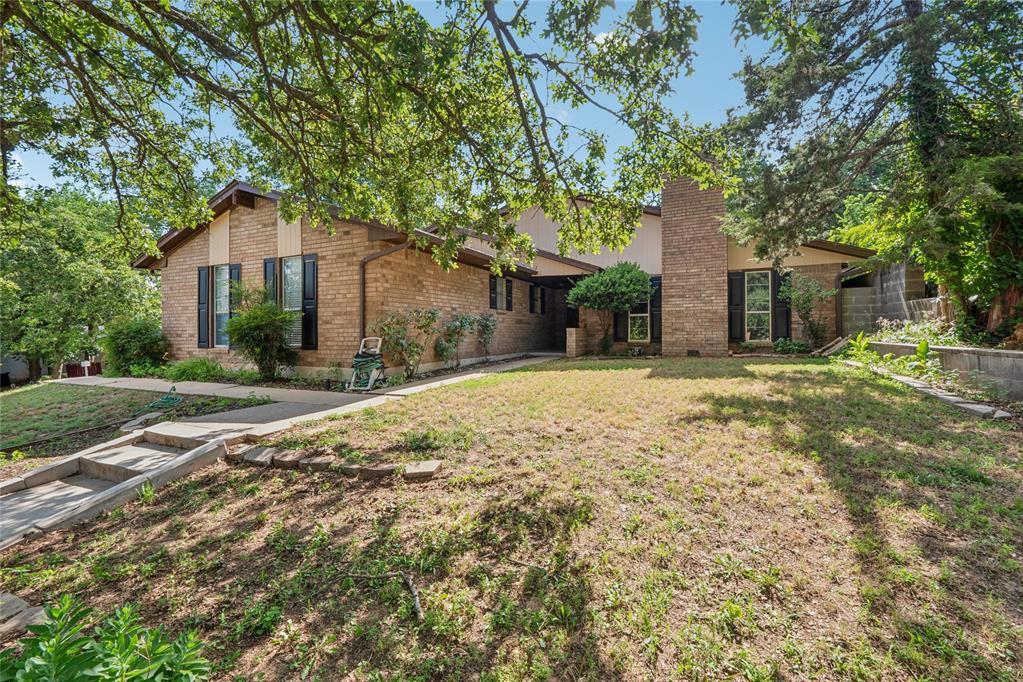 Nestled on a corner lot, this spacious 3-bedroom, 2 bath home offers a spacious layout with good bones ready for your personal touch. This property is perfect for families or anyone looking to invest in a great neighborhood. Enjoy outdoor living in the large back patio, ideal for entertaining or enjoying a quiet evening. The generous backyard is fully fenced, making it great for pets.