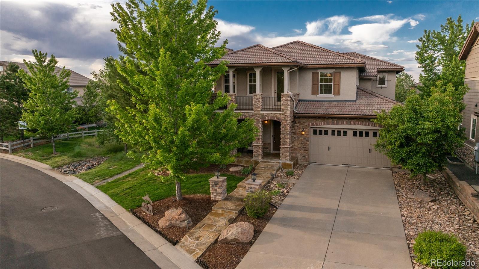 Perfectly positioned on a premium lot backing and siding to open space and scenic trails, this rare Whispering Wind model offers an exceptional combination of privacy, space, and breathtaking surroundings. With five bedrooms plus an expansive bonus room featuring its own private balcony, this home is truly one of a kind. The main level welcomes you with soaring vaulted ceilings in the formal dining area and an open, inviting floor plan designed for both everyday living and entertaining. The spacious kitchen features a large center island, walk-in pantry, breakfast nook, and abundant workspace. A desirable main-floor guest suite with a private bath provides comfort and flexibility for visitors or multi-generational living. Step outside to the covered patio and enjoy the tranquil water feature and peaceful open-space views. Upstairs, the oversized primary retreat offers a cozy sitting area, fireplace, and an impressive walk-in closet. The finished basement expands the living space even further with a gym or additional guest suite, a large family room, and plenty of room for recreation, games, or a home theater. Embrace the Backcountry lifestyle with resort-style pools, a fitness facility, coffee shop, trails, parks, ponds, and so much more.