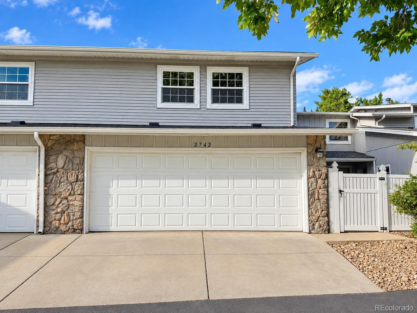 Welcome home to this beautifully remodeled, move-in-ready 4-bedroom townhome in desirable Heather Ridge South! Thoughtfully updated and in excellent condition, this home offers a fresh, modern feel with a spacious and functional layout.Enjoy new flooring throughout, fresh interior paint, new HOA-approved windows and sliding doors, and newly added central A/C. Vaulted ceilings enhance the bright, open atmosphere, while the spacious living room features a striking stone-accented fireplace that creates a warm and inviting focal point.The refreshed kitchen features new appliances, abundant cabinetry, generous counter space, and an eat-in area. The bathrooms have been updated with new vanities, faucets, fixtures, showers, and bath finishes. The primary suite offers a walk-in closet and private en-suite bathroom, while two additional bedrooms provide flexibility for family, guests, or a home office.The finished basement provides valuable additional living space, ideal for a recreation room, office, fitness area, or additional sleeping space, plus a convenient laundry area.Step outside through the new sliding doors to the private patio, perfect for relaxing or entertaining. Conveniently located near parks, schools, shopping, dining, recreation, and everyday amenities. With extensive updates throughout, this Heather Ridge South townhome is truly move-in ready and ready to welcome its next owner!