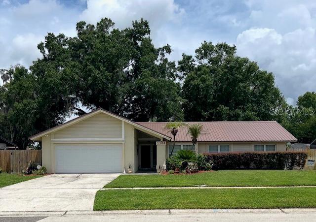Welcome to Walden Lake! This beautifully maintained 3-bedroom, 2-bath home offers a desirable split-bedroom floor plan and numerous updates throughout. Features include an updated kitchen, updated bathrooms, tile flooring throughout, and multiple French doors that fill the home with natural light. The enclosed Florida room provides valuable additional living space perfect for relaxing, working, or entertaining. Step outside to a fully fenced backyard complete with a corner deck for grilling and a gazebo for enjoying Florida’s beautiful weather. Major updates include a METAL roof installed in November 2023 and A/C replaced in August 2021. Residents enjoy access to community amenities including a pool, clubhouse, playground, tennis courts, and basketball courts for a low annual HOA fee of $275. Conveniently located near shopping, dining, schools, and major commuter routes, this move-in ready home offers the best of Walden Lake living.