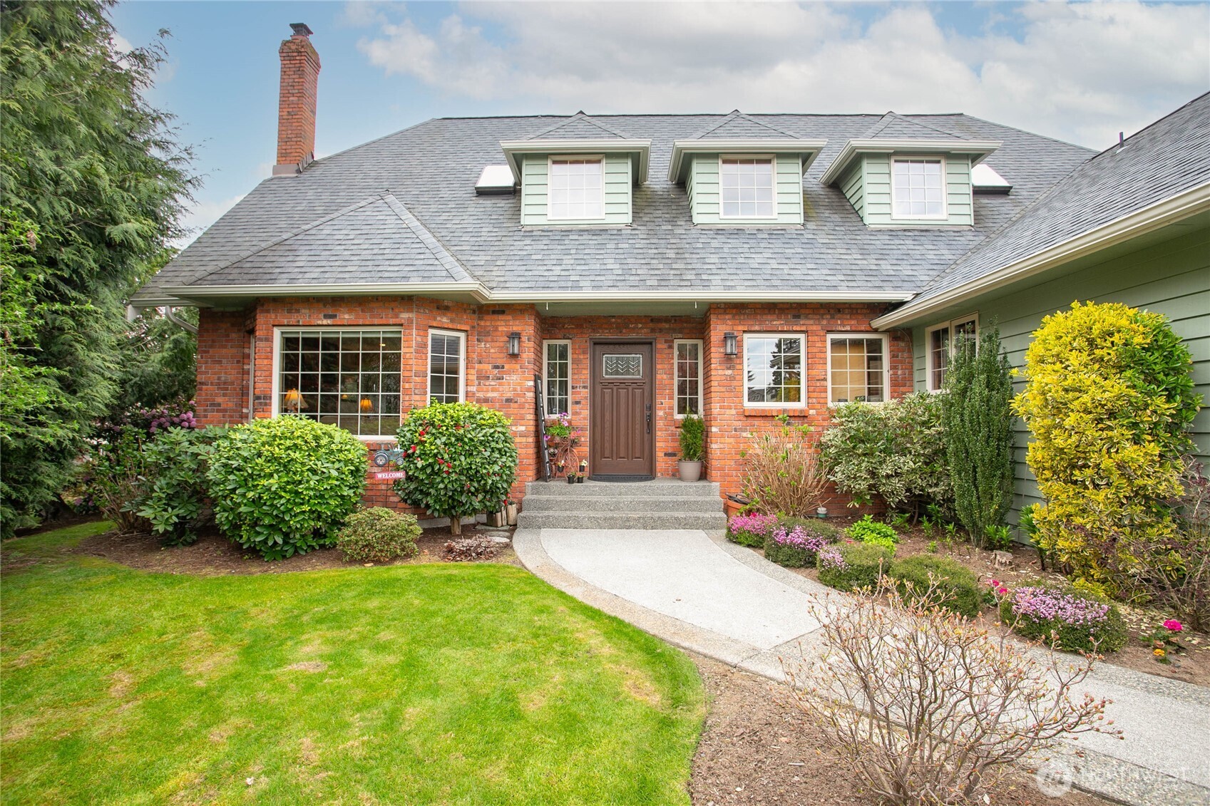 Remarkable one of a kind nearly 4,000 sq ft home in hidden gem Fairview west Lynden neighborhood. Very evident this home was built from the start with quality, attention to detail, and to LAST. From the beautiful brick and real wood exterior to the gorgeous refinished oak floors throughout the interior, it won't disappoint. Soaring two story foyer greets you with curved stairway leading to open upstairs hall. Enjoy relaxing in inviting cozy living room with gas fireplace surrounded by lovely brick including hearth - open to dining room yet clearly separate. Spacious kitchen with ample cabinets, upgraded stainless steel appliances, walk in pantry, granite & beautiful pastoral views. Great size family room w/access to huge custom trex deck tucked back off kitchen, perfect place to unwind. Owner's suite with sitting area, ensuite bath and large walk-in closet upstairs. Both upstairs bathrooms have been beautifully updated with tile flooring, quartz counters, new fixtures & a huge walk-in shower in the owner's ensuite. Excellent layout with 3 more great size bedrooms upstairs, office on main, and still plenty of room in basement! Basement has direct access to outside via garage, giving great potential for separate suite/multi-gen living with rough-ins, 3/4 bath, existing well windows and lots of room to make it your own. Complete w/3 car epoxy floor garage, AC, and never to be built behind in a nice quiet cul-de-sac. Incredibly well-maintained and ready for its new owners!