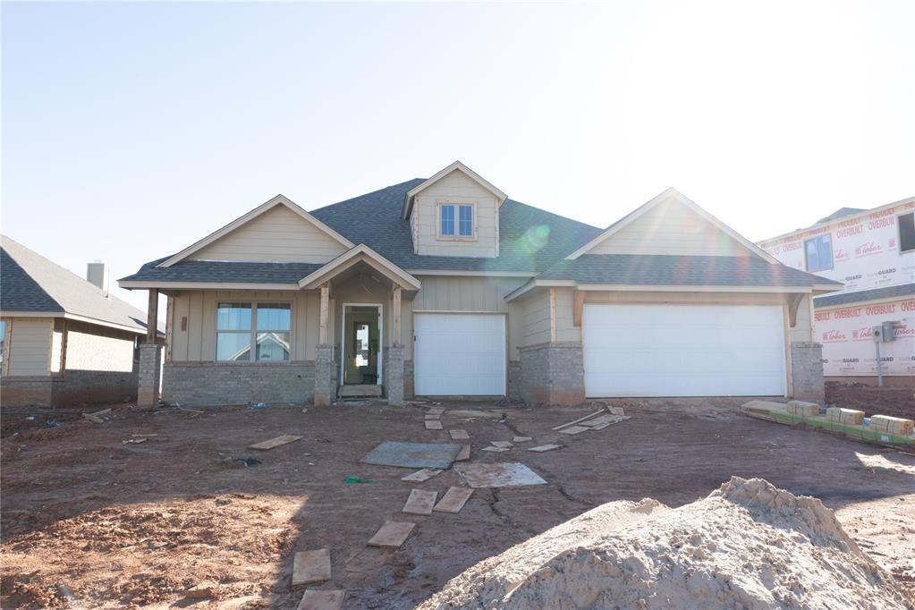 This Shiloh floor plan offers 2,220 Sqft of total living space, which includes 1,950 Sqft of indoor living space and 270 Sqft of outdoor living space. There is also a 625 Sqft three car garage with a storm shelter installed. At Homes by Taber, we include a storm shelter in every home because safety is not an option. This home offers 4 bedrooms, 2 full bathrooms, 2 covered patios, and a utility room. The great room features a luxurious coffered ceiling with a ceiling fan, a stacked stone surround gas fireplace, large 7’ windows, rocker switches throughout, wood-look tile, and Cat6 wiring! The up-scale kitchen has stainless steel appliances, custom-built cabinets to the ceiling with under cabinet lighting and cabinet hardware throughout, a large center island featuring a trash can pullout, stunning pendant lighting, a large corner pantry, and attractive tile backsplash. The primary suite features a sloped ceiling detail, a ceiling fan, our cozy carpet finish, and two HUGE walk-in closets. The primary bath has a European walk-in shower, a free-standing tub, a private water closet, modern tile flooring, and separate vanities with framed mirrors. The covered back patio includes a wood-burning fireplace, a gas line, and a TV hookup. Other amenities include healthy home technology, a fresh air ventilation system, a tankless water heater, R-44 and R-15 insulation, and so much more!